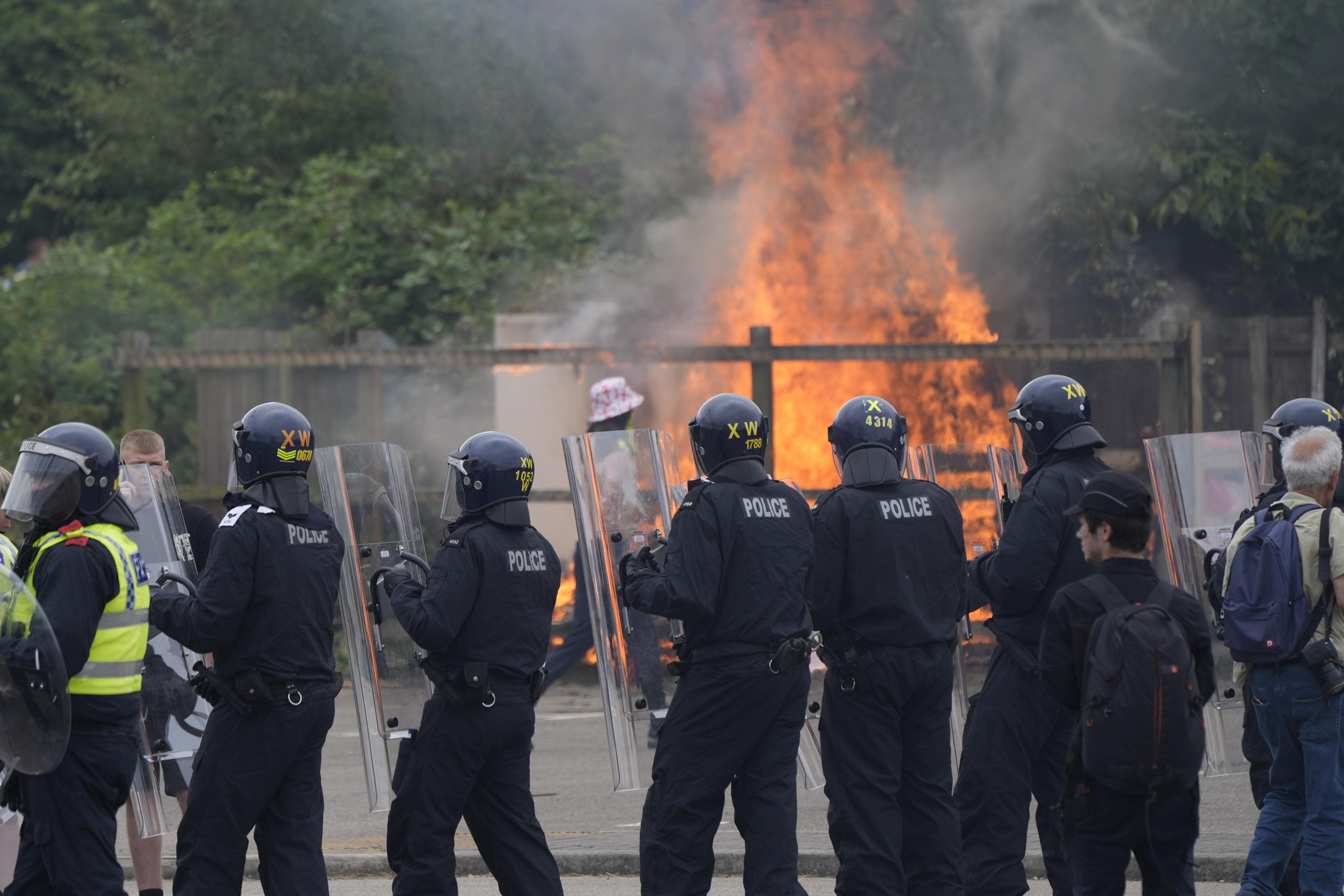 An anti-immigration demonstration outside the Holiday Inn Express in Rotherham, South Yorkshire (Danny Lawson/PA)