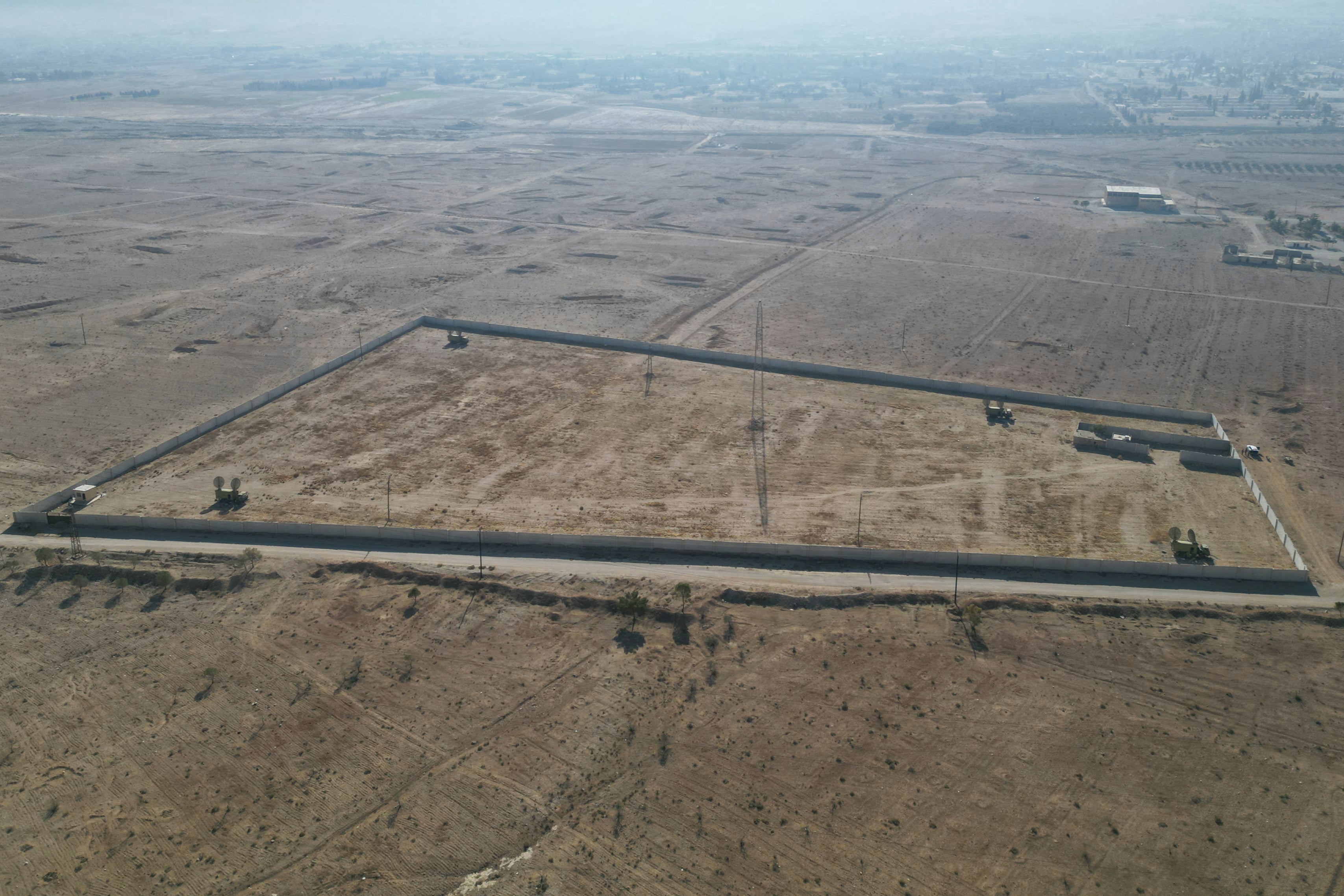 A drone view shows the site of the mass grave in a remote location around 25 miles northeast of the Syrian capital Damascus