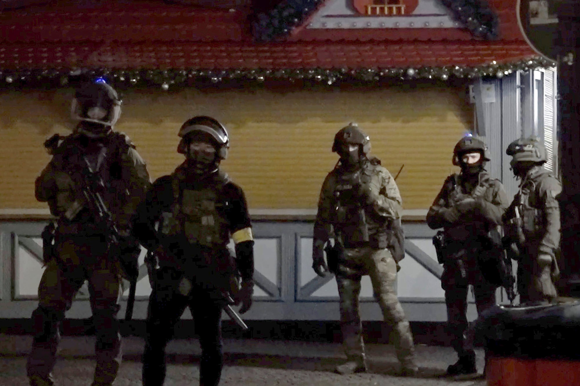 Soldiers guard the scene of the market