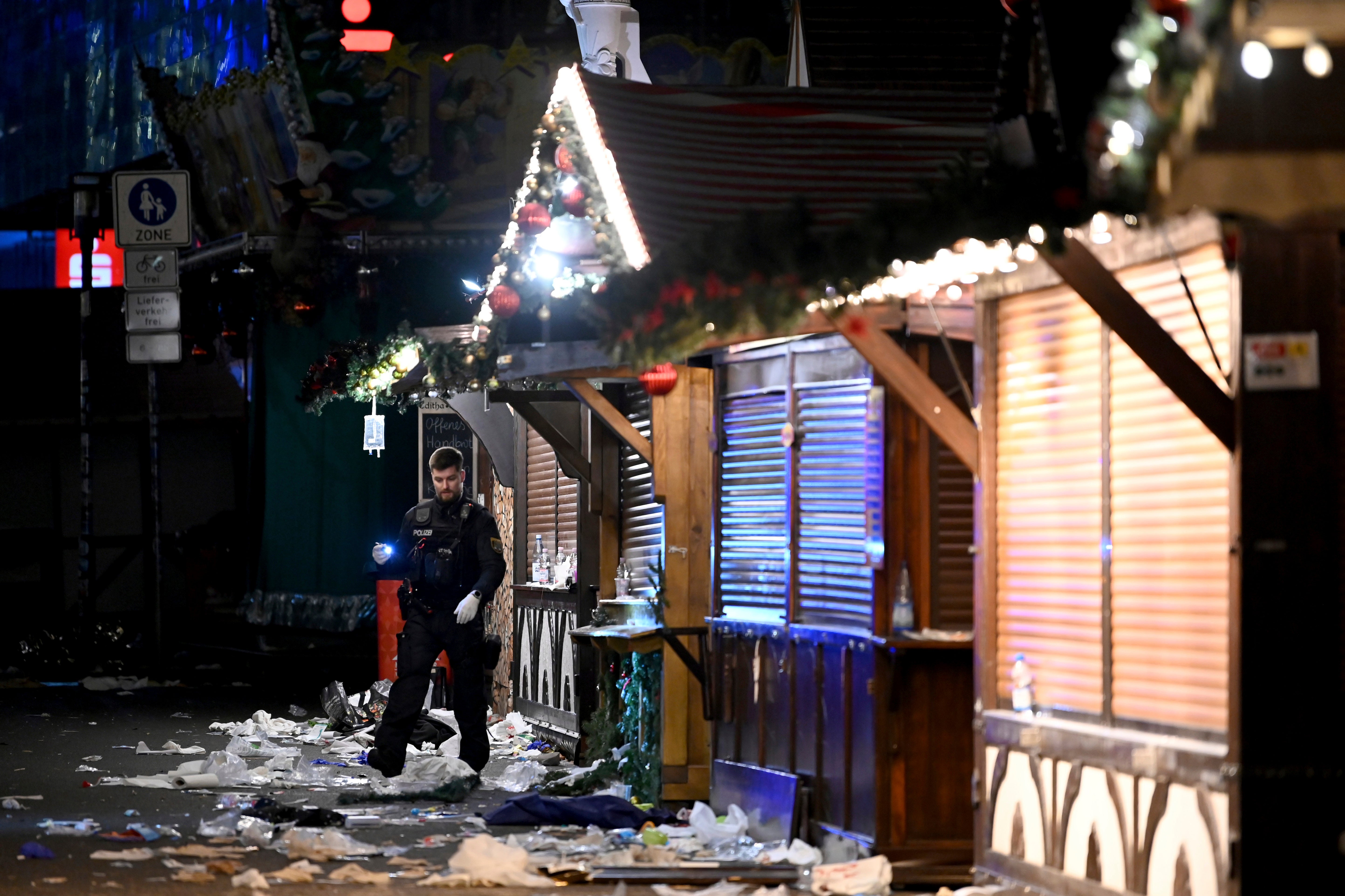 Debris litters the floor of the Christmas market following the attack