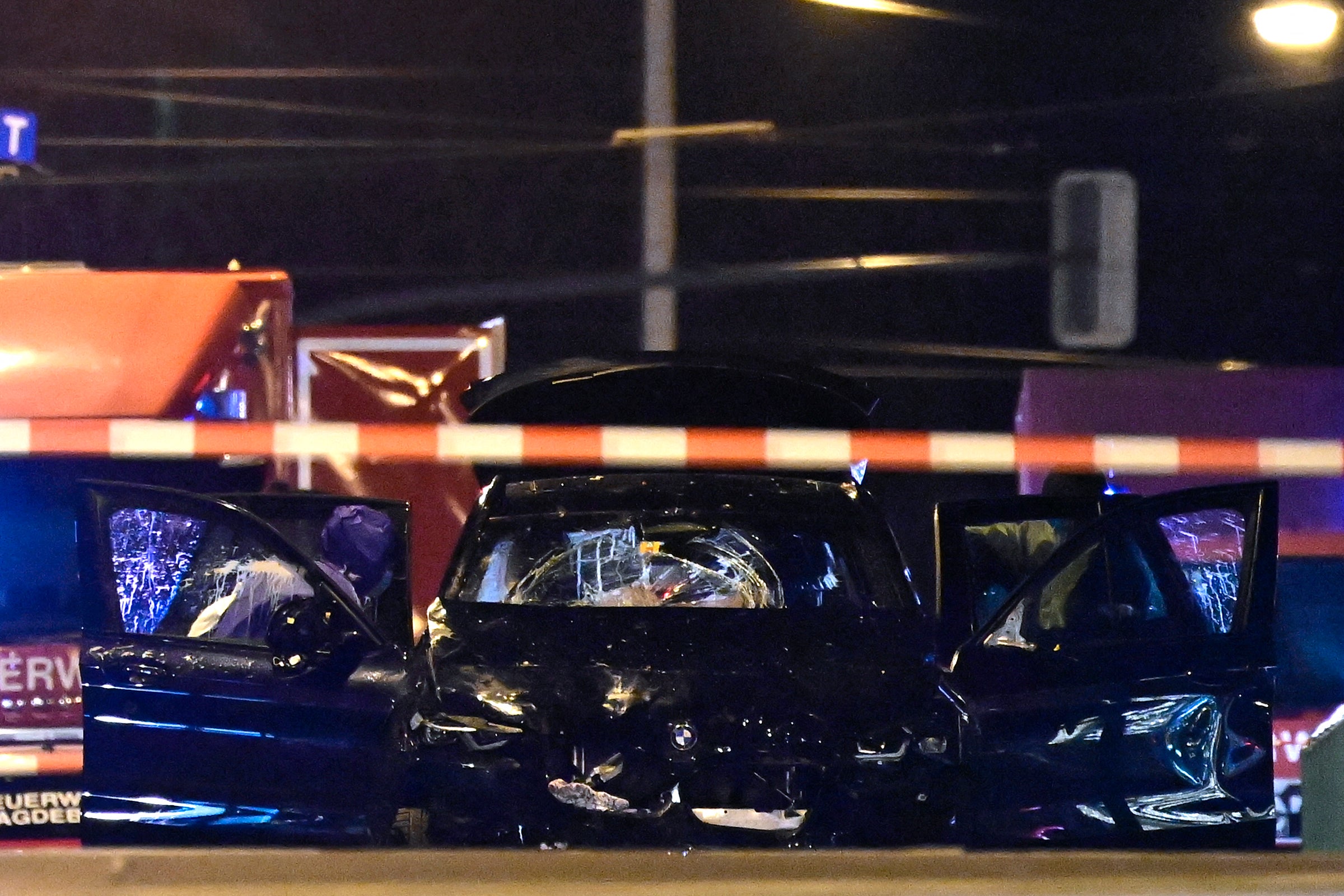 The suspect’s smashed up car behind a police cordon