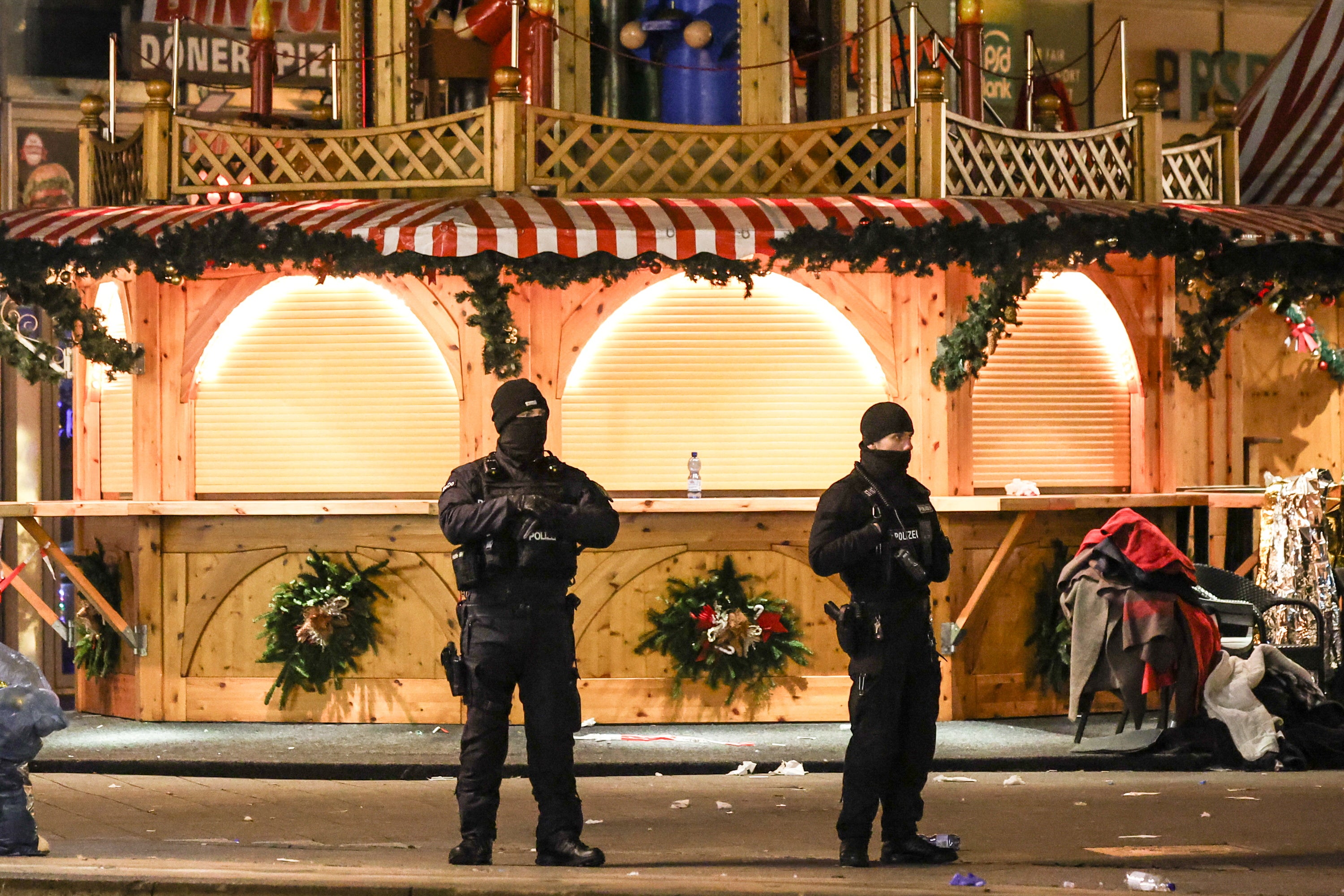 Police and security patrol the deserted Christmas market