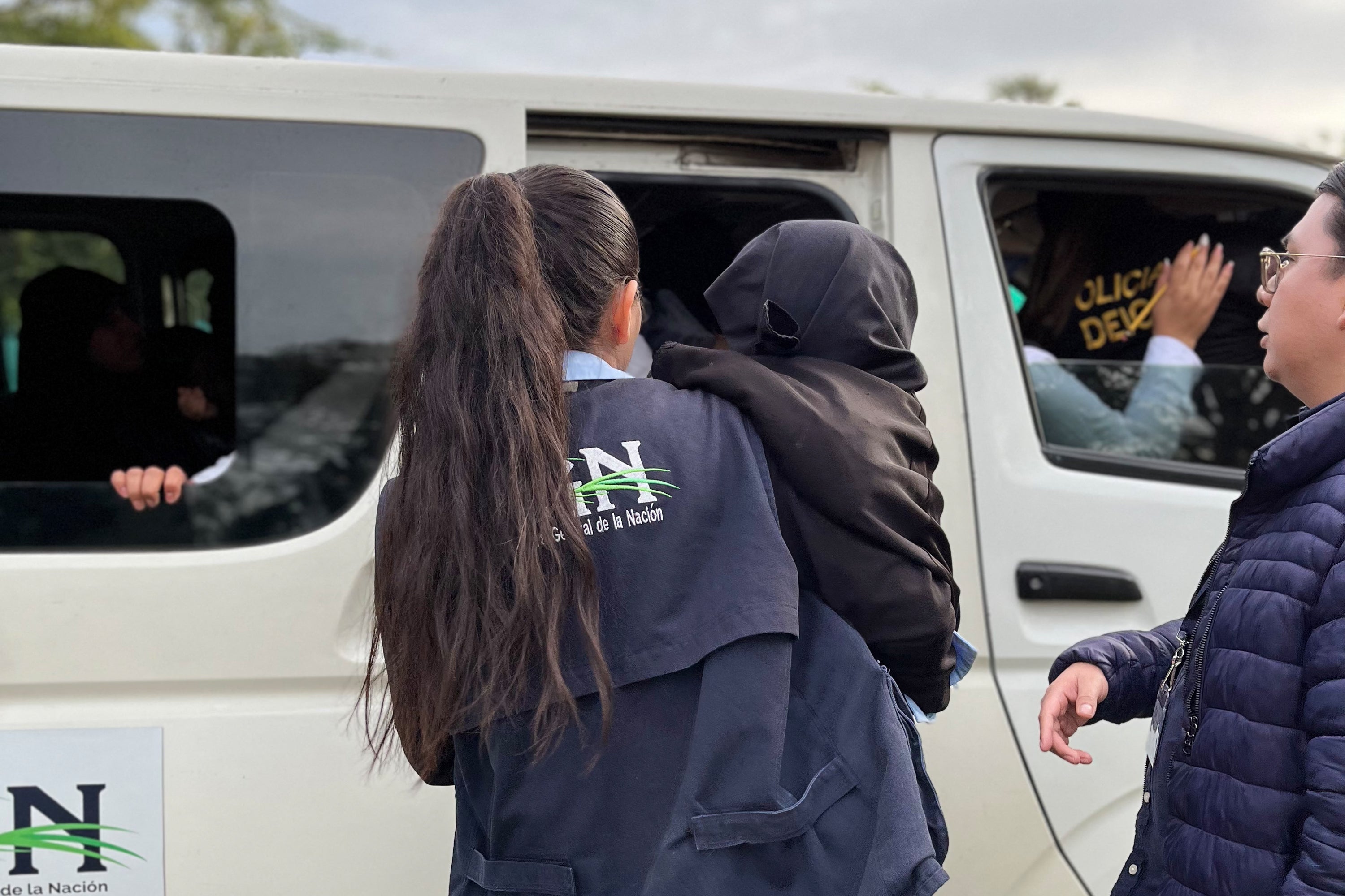 Police take part in a child rescue operation at a farm in the municipality of Oratorio, Guatemala