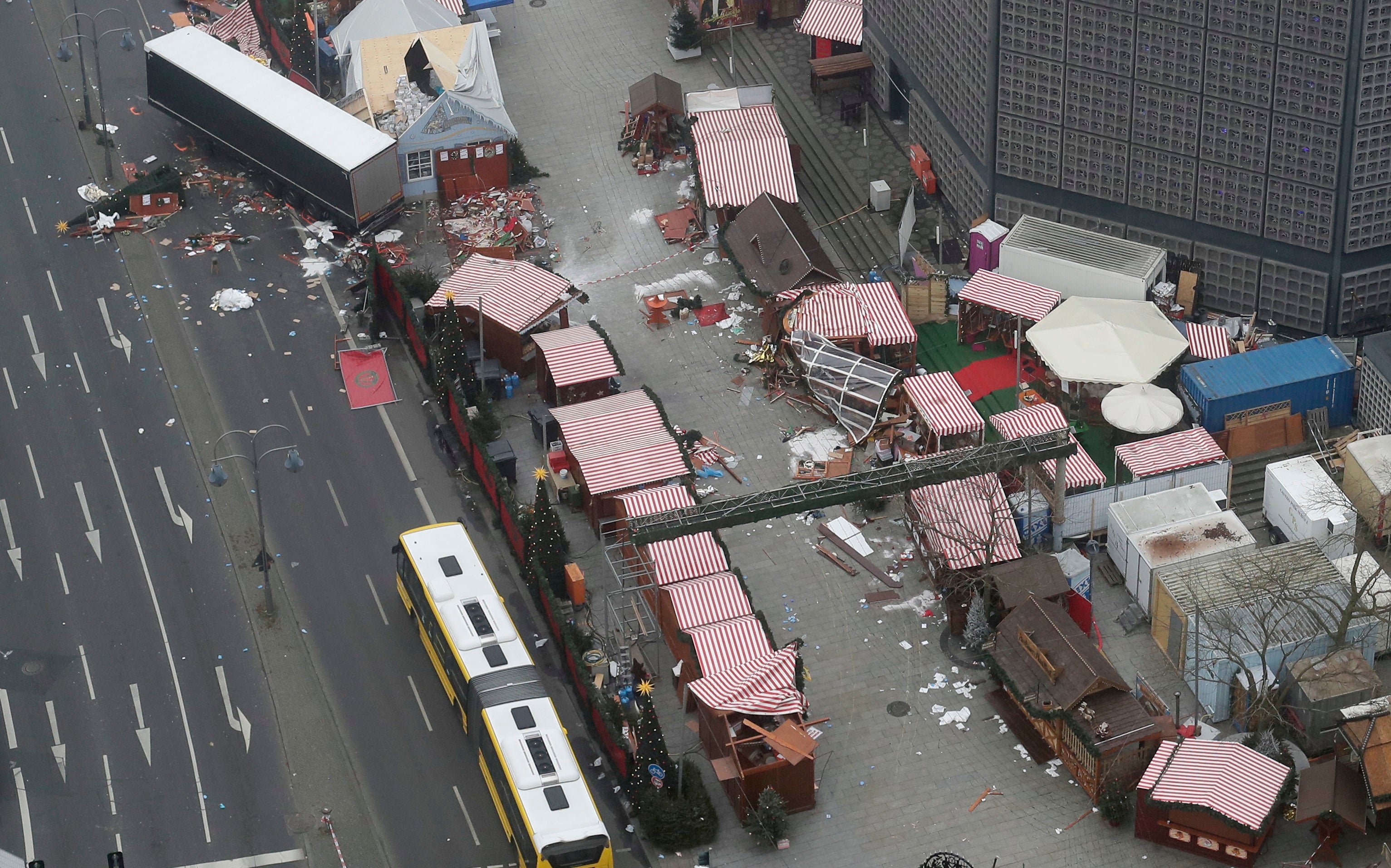 Destroyed huts visible in the Christmas market