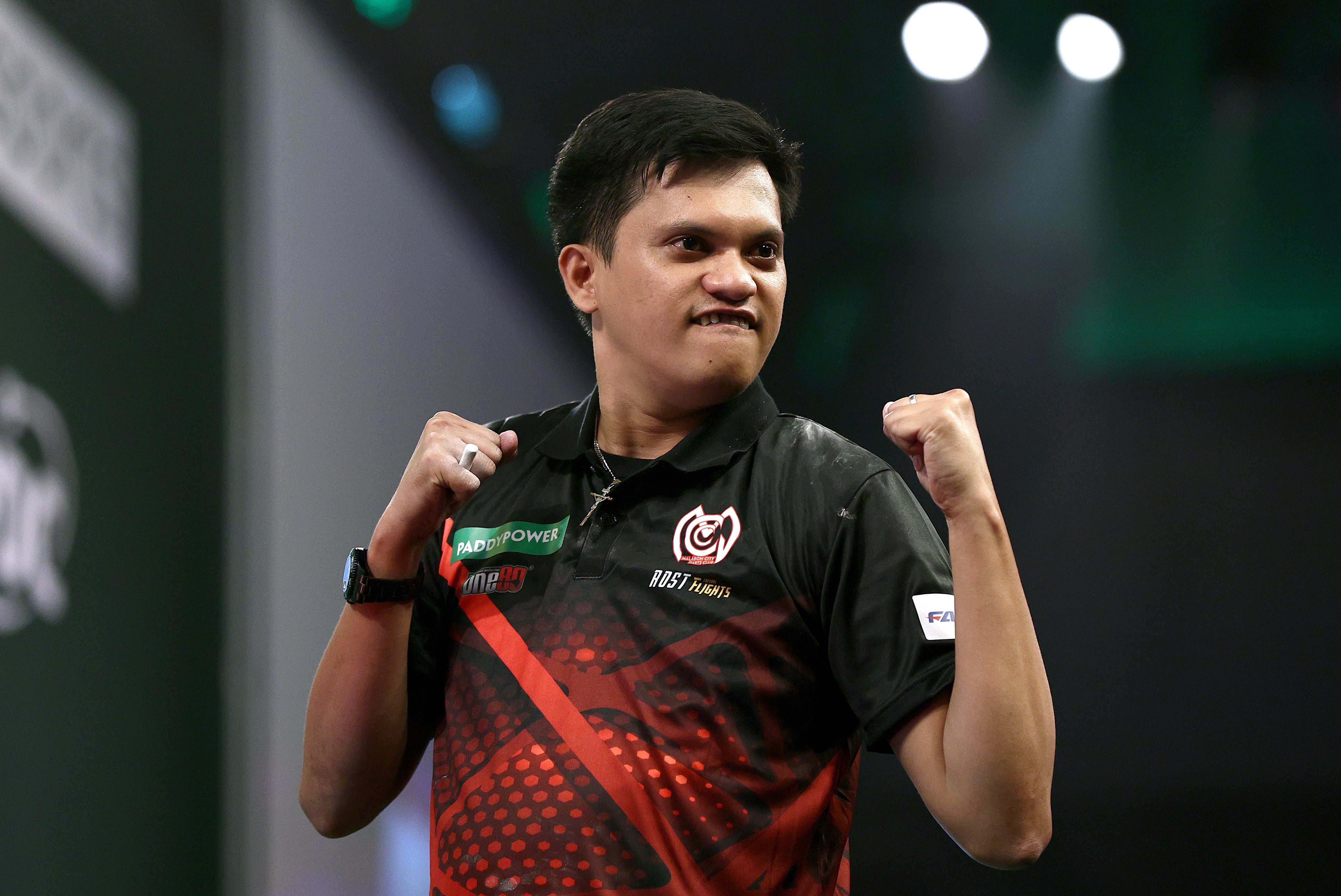 Alexis Toylo of The Phillippines celebrates at the World Darts Championship