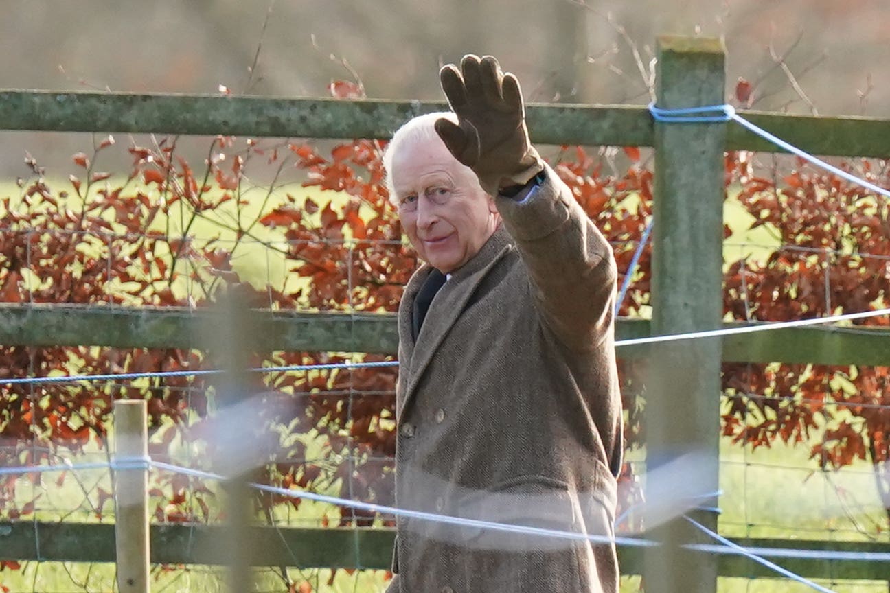 The King waves to well-wishers as he leaves a church service at St Mary Magdalene Church in Sandringham on Sunday (Jacob King/PA)