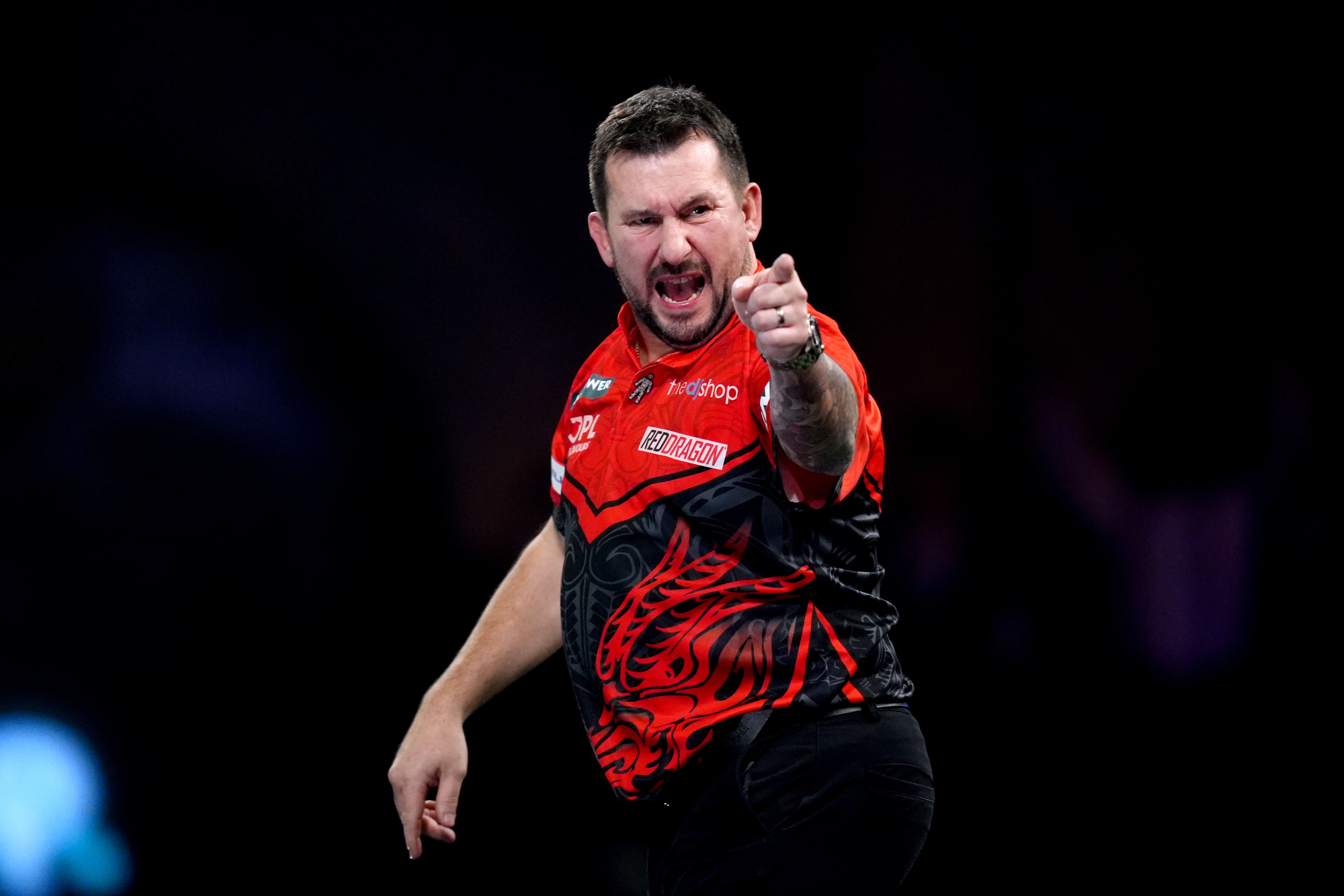 Jonny Clayton dug in to book his place in round three at Alexandra Palace (John Walton/PA)