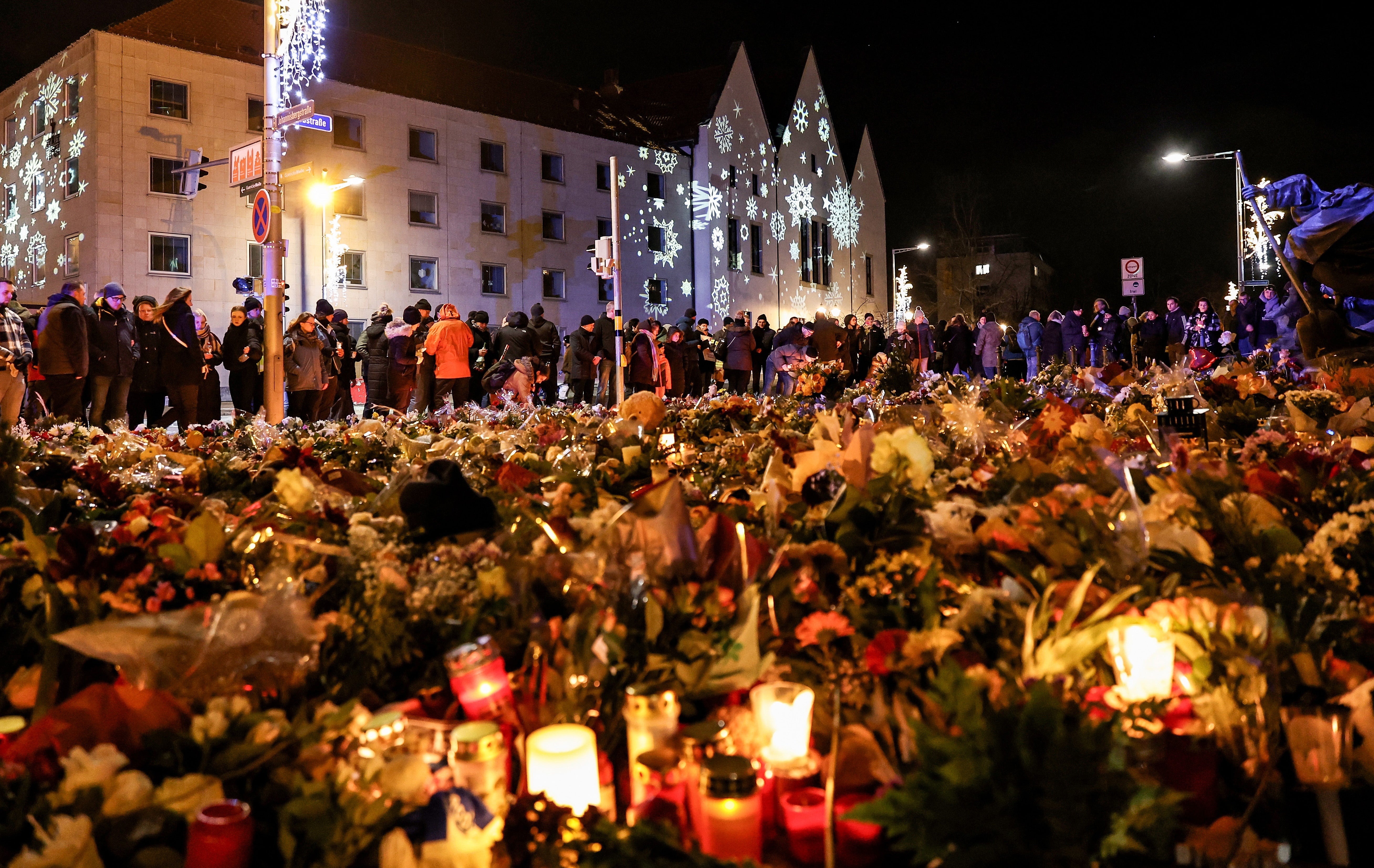 Candles and flowers outside the Johanniskirche in Magdeburg on Monday