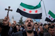 Syrian protests erupt over video of fighters burning Christmas tree