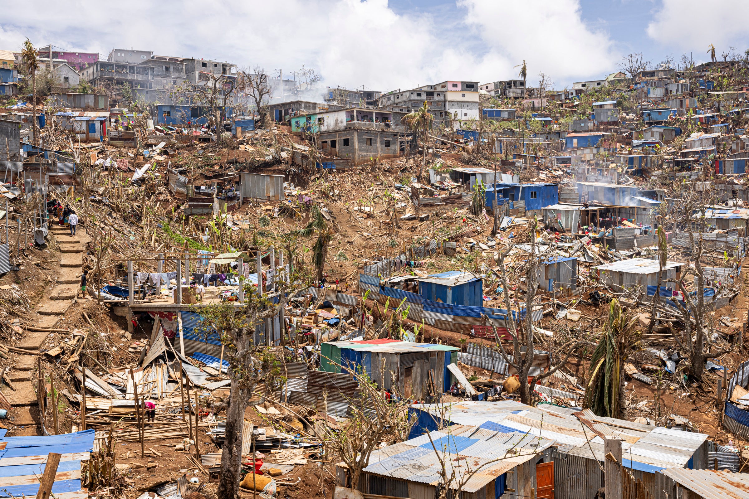 A general view of damaged shelters and houses in the town of Vahibe, on the outskirts of Mamoudzou, on the French Indian Ocean territory of Mayotte