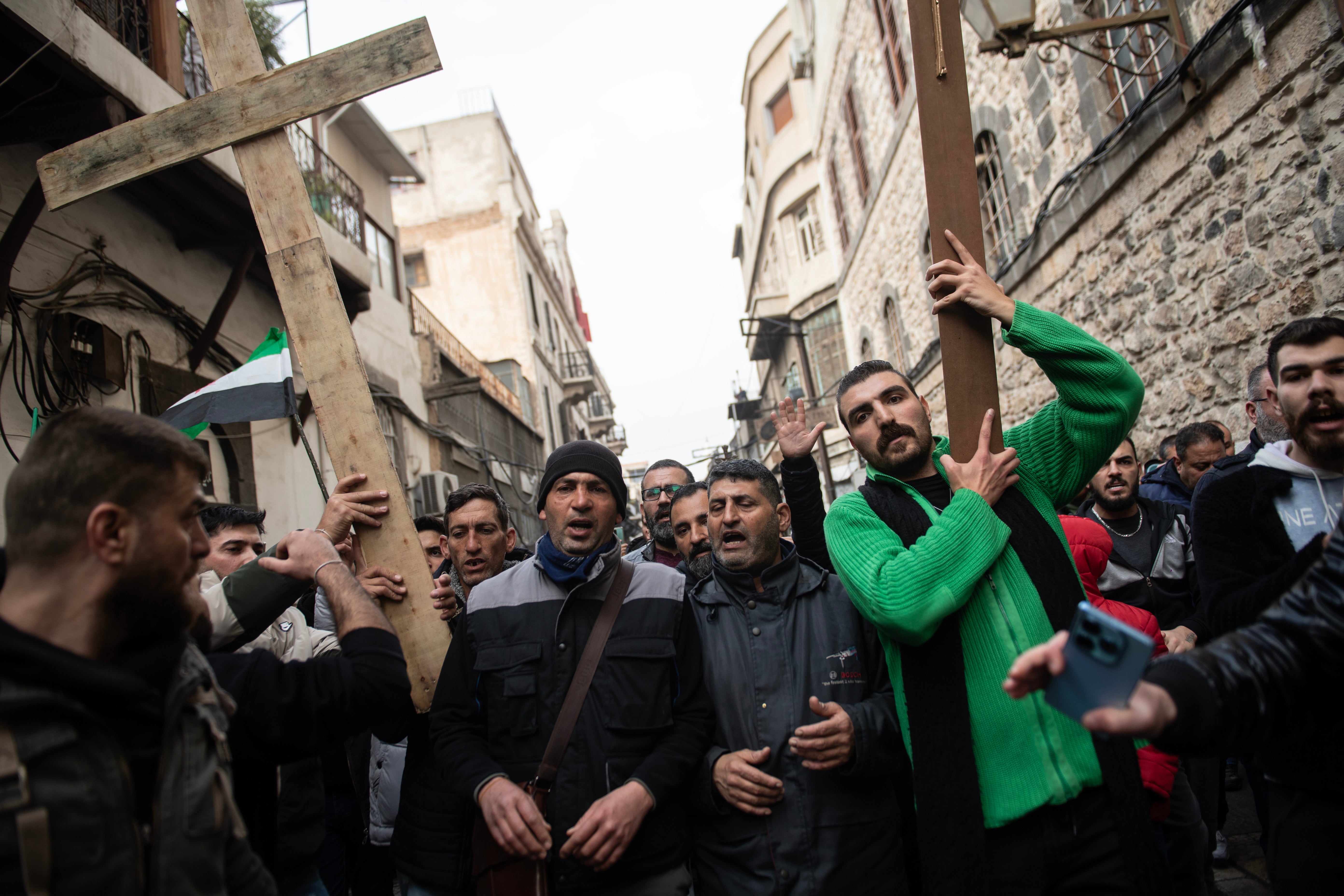 Protesters with crosses during a demonstration in Damascus