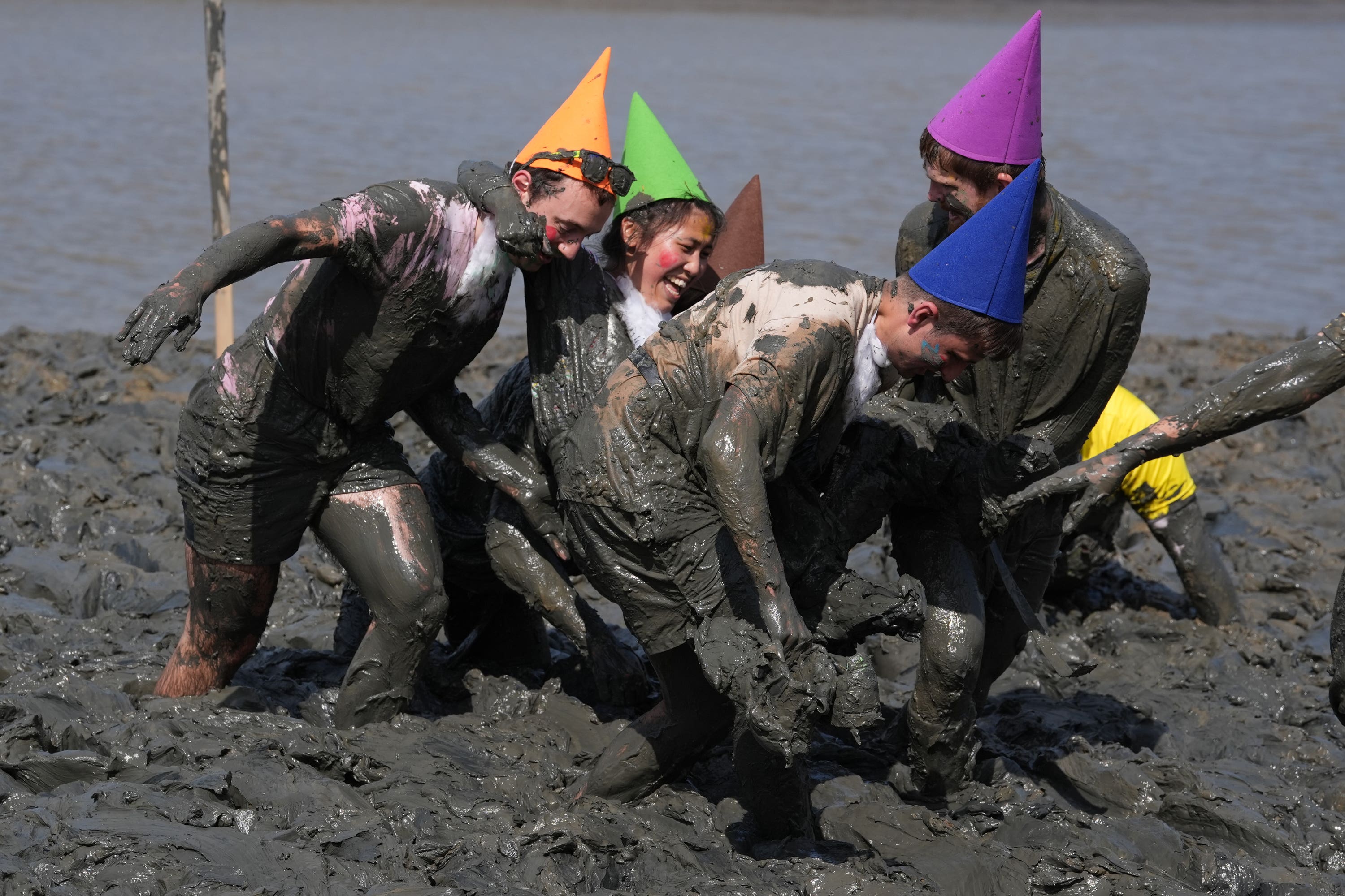 Competitors take part in the annual Maldon Mud Race (Gareth Fuller/PA)