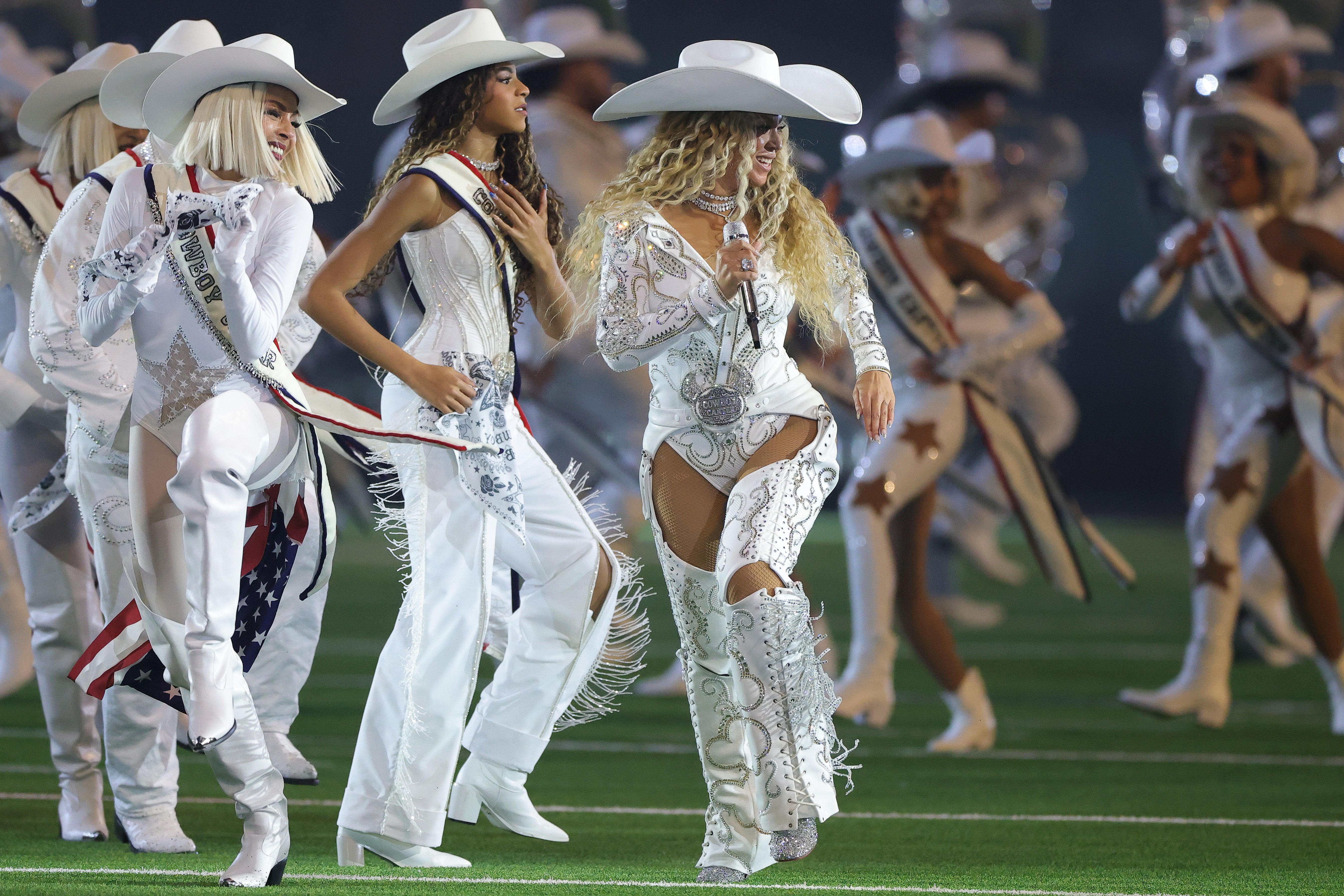 Beyoncé and her daughter Blue Ivy performing during the halftime show for the game between the Baltimore Ravens and the Houston Texans at NRG Stadium