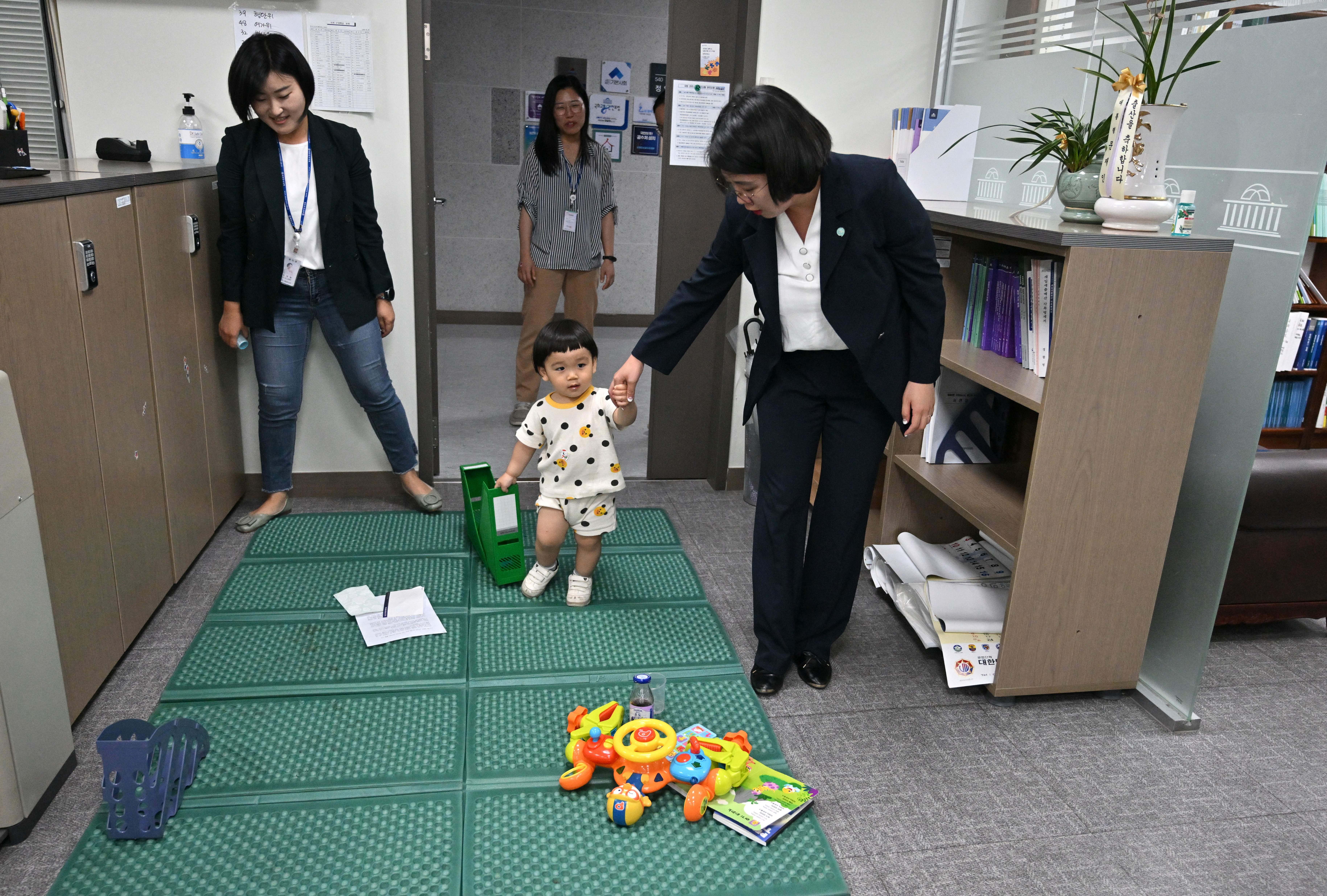 Lawmaker Yong Hye-in with her son in her National Assembly office in Seoul