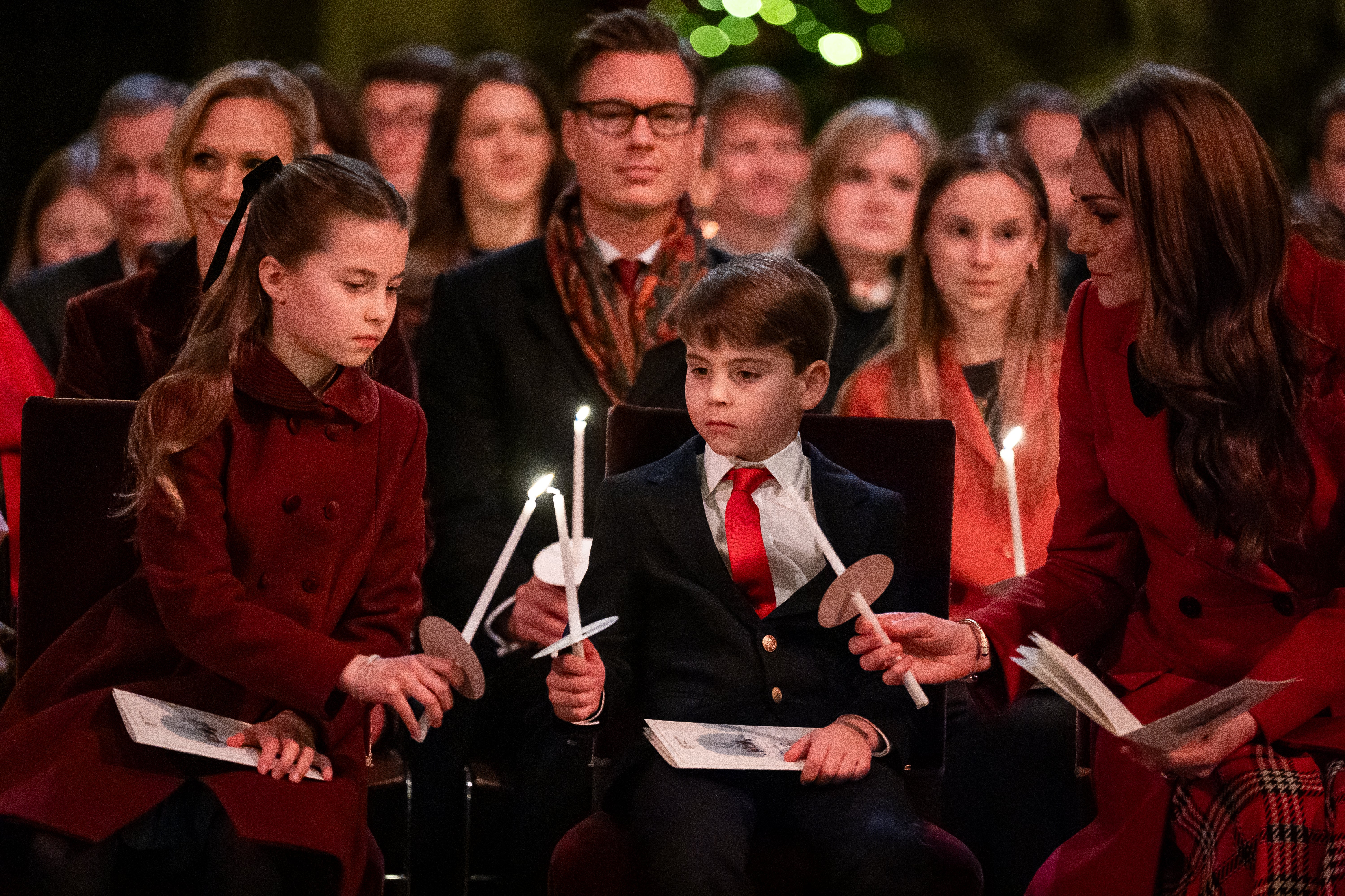 Kate lights candles with her children Charlotte and Louis at the 2024 ‘Together at Christmas’ event