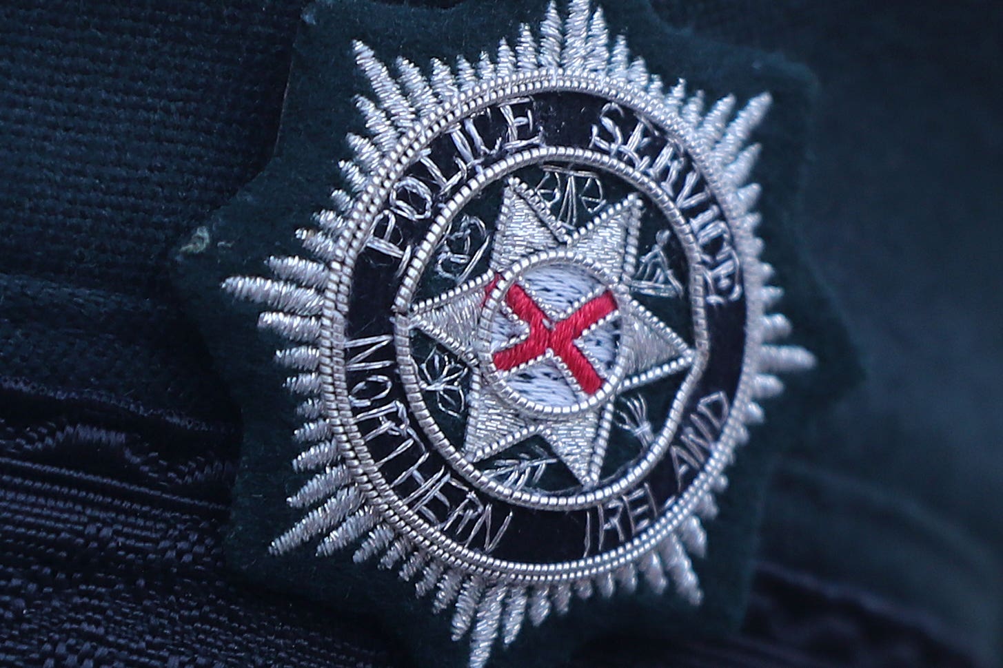 A stock picture of a Police Service of Northern Ireland (PSNI) logo badge (Niall Carson/PA)