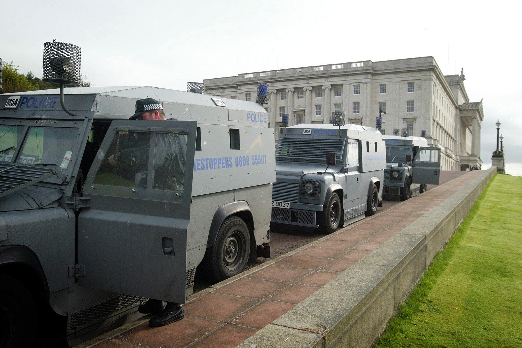 Police prepare to leave Stormont after a raid on the Sinn Fein office in 2002 (Paul Faith/PA)