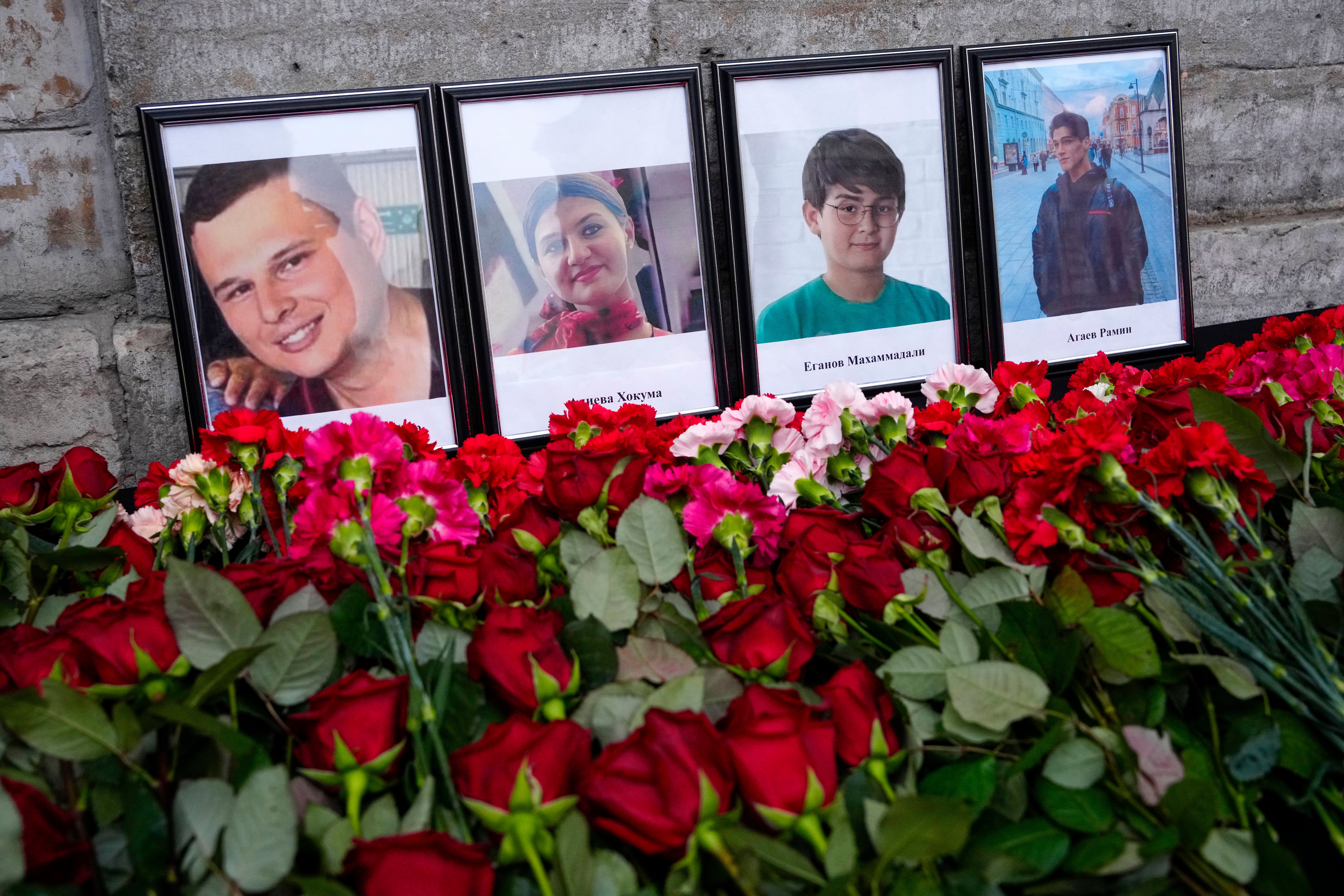 Flowers and portraits are placed at the Consulate of Azerbaijan in St Petersburg, Russia