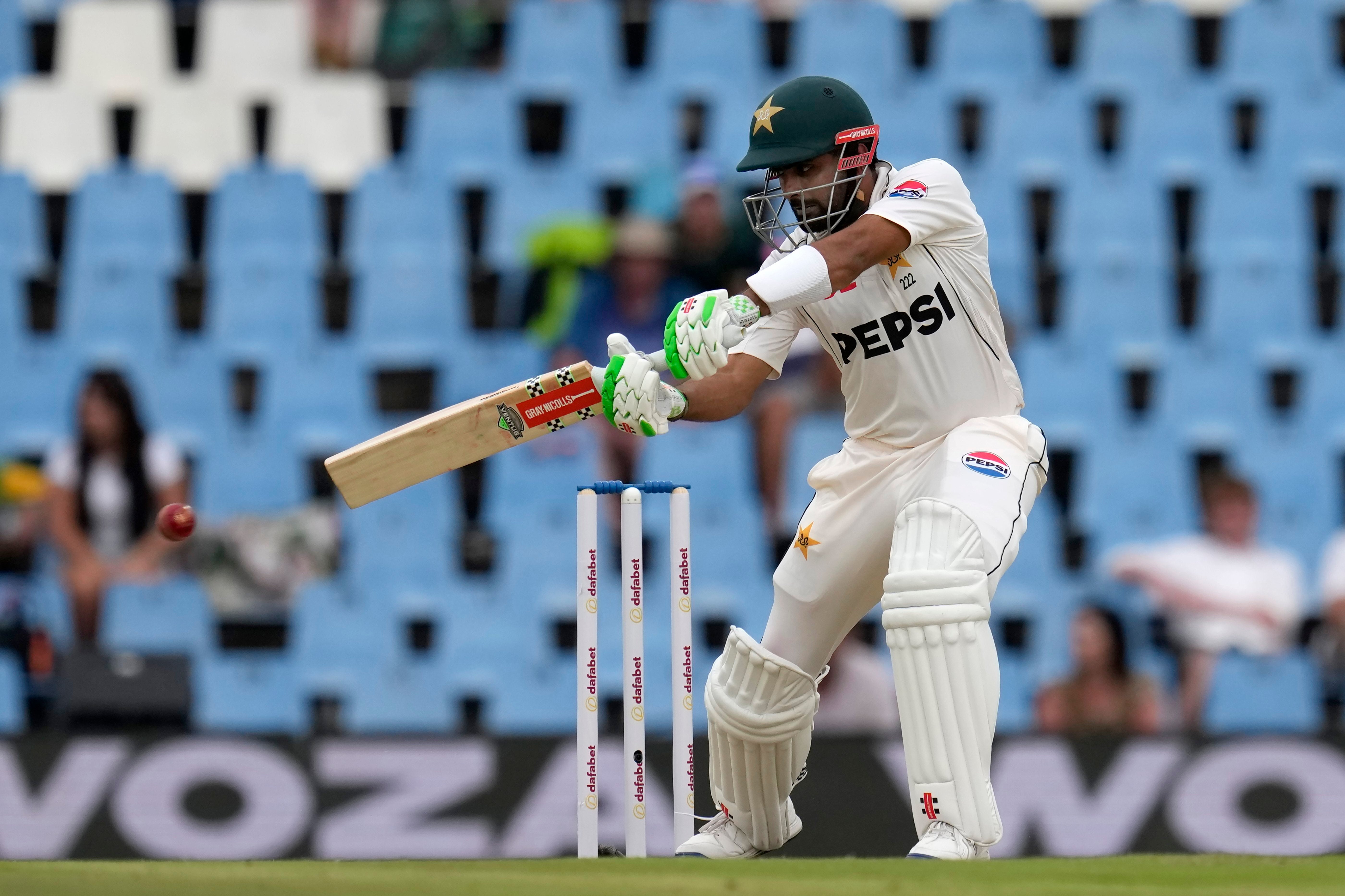 Pakistan's Babar Azam plays a side shot during day two