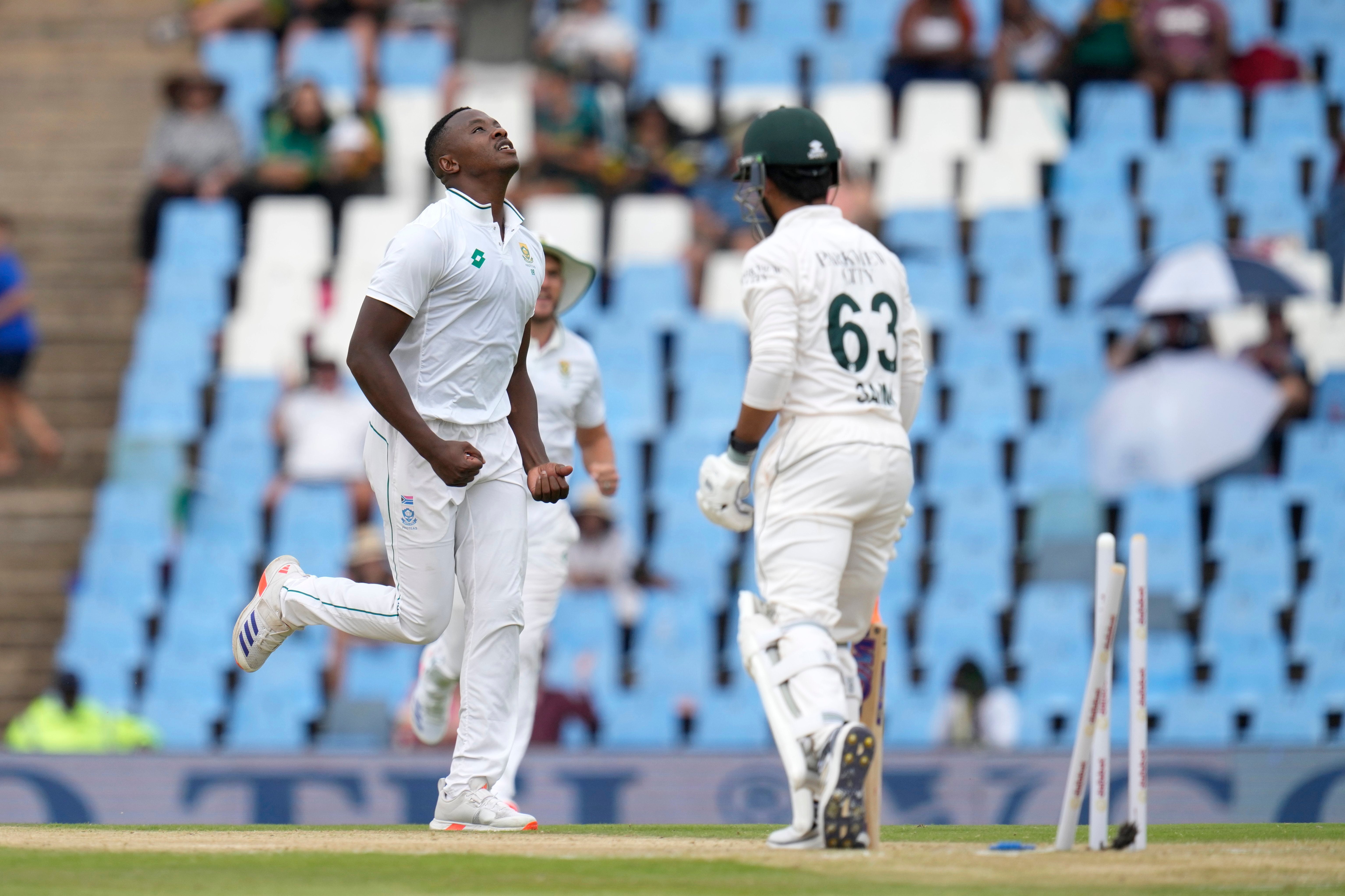 South Africa's Kagiso Rabada, left, celebrates after bowling out Pakistan's Saim Ayub