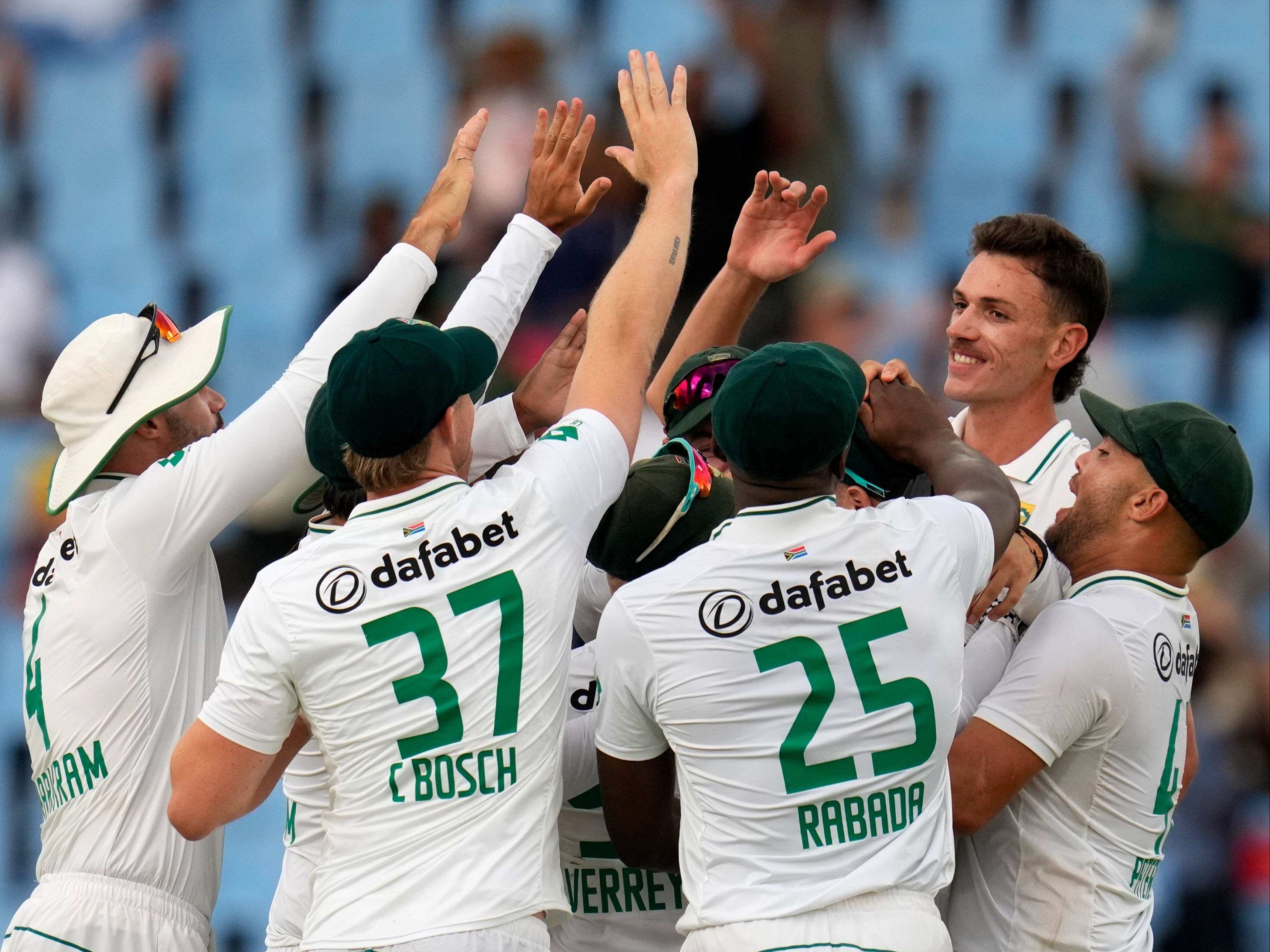 South Africa's Marco Jansen, second right, celebrates with his teammates after taking a wicket of Pakistan's Kamran Ghulam