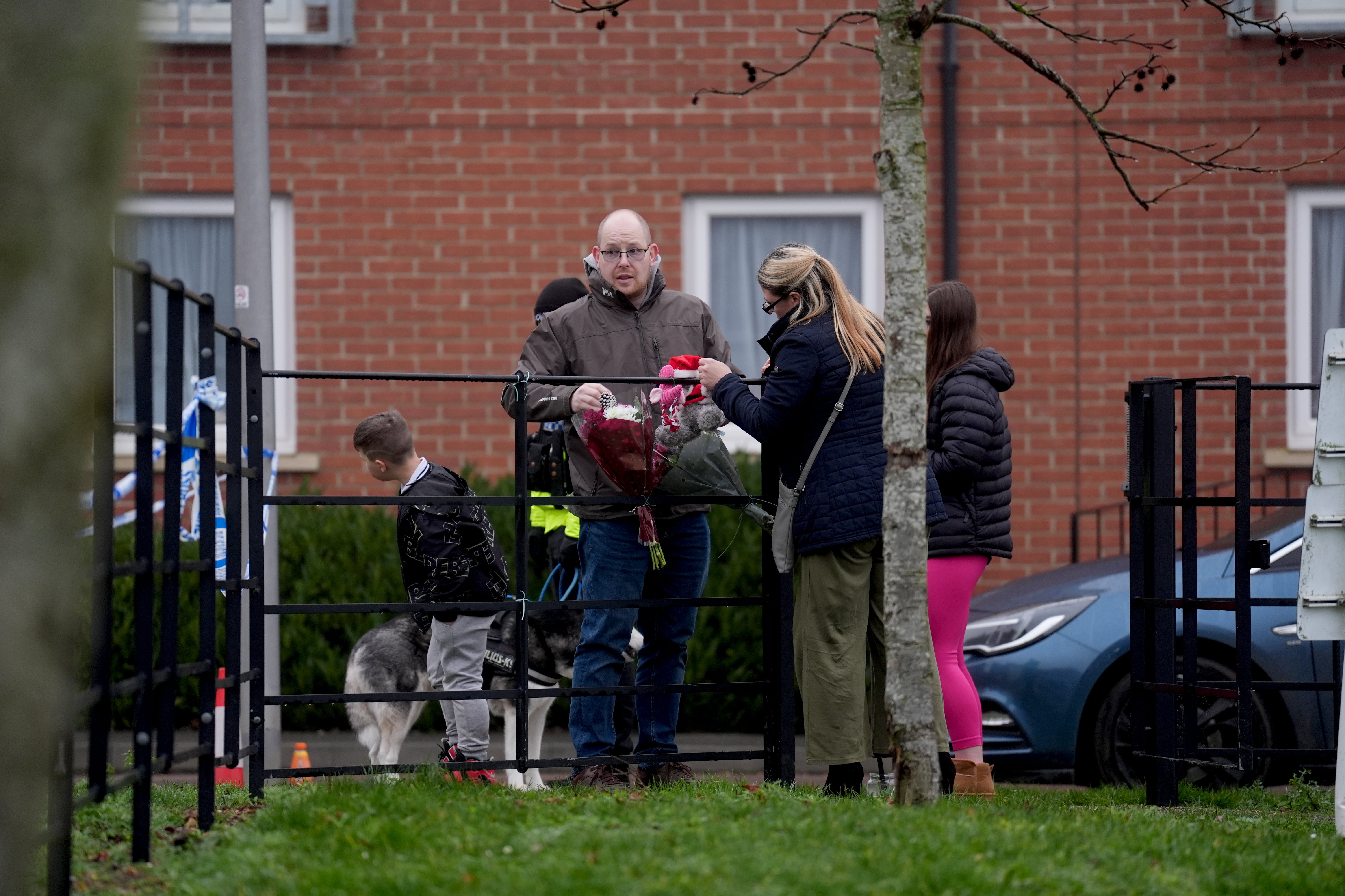 Residents of the flats have left tributes close to where the women were discovered