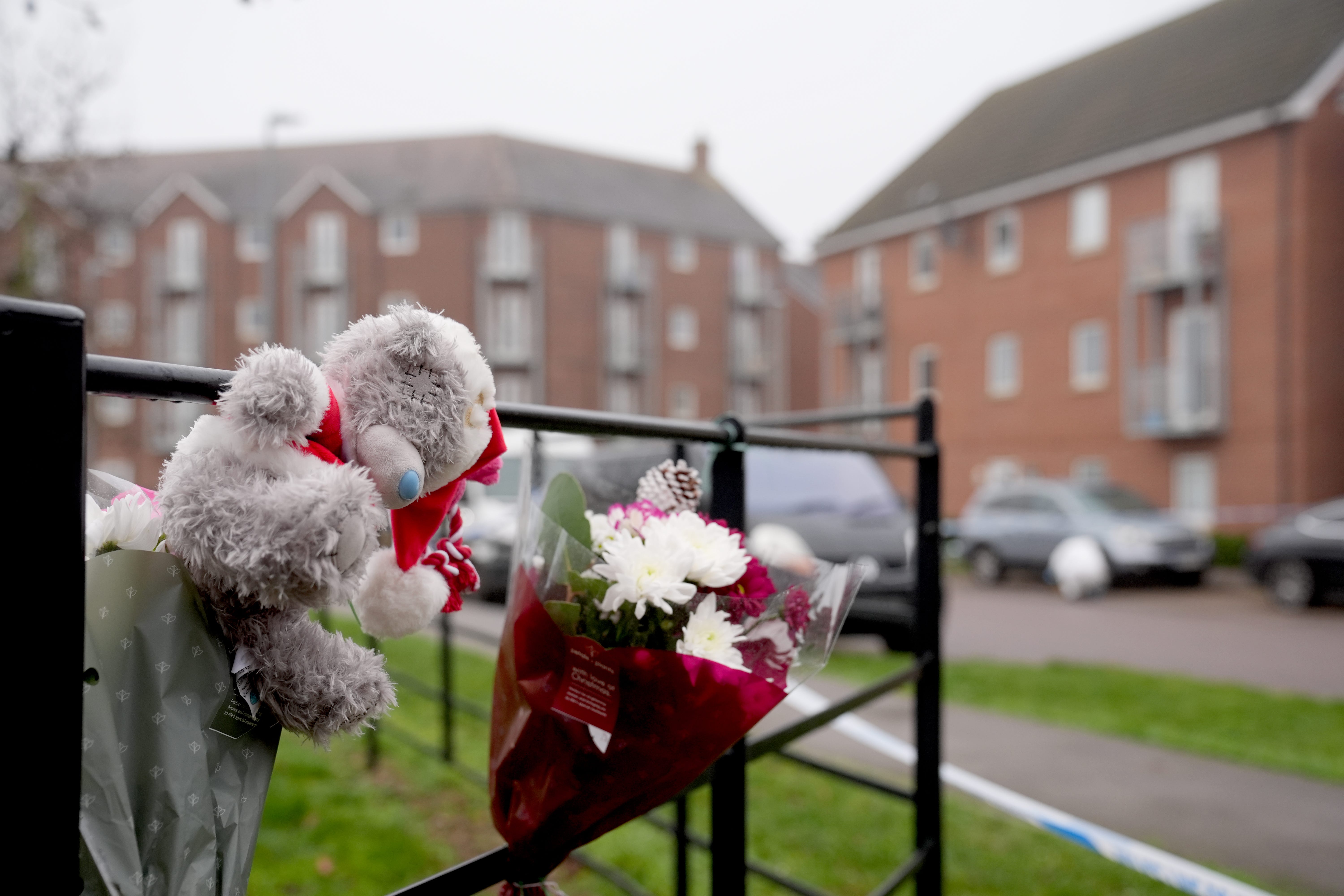 Floral tributes have been laid near the scene where two women died on Christmas Day (Joe Giddens/PA)