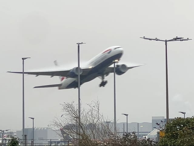 <p>Into the gloom: British Airways Boeing 787 taking off at London Heathrow</p>