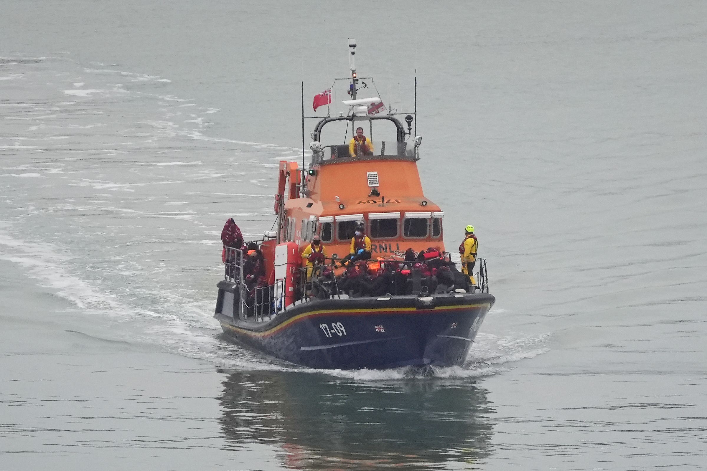 A group of people thought to be migrants are brought in to Dover by the RNLI (Gareth Fuller/PA)