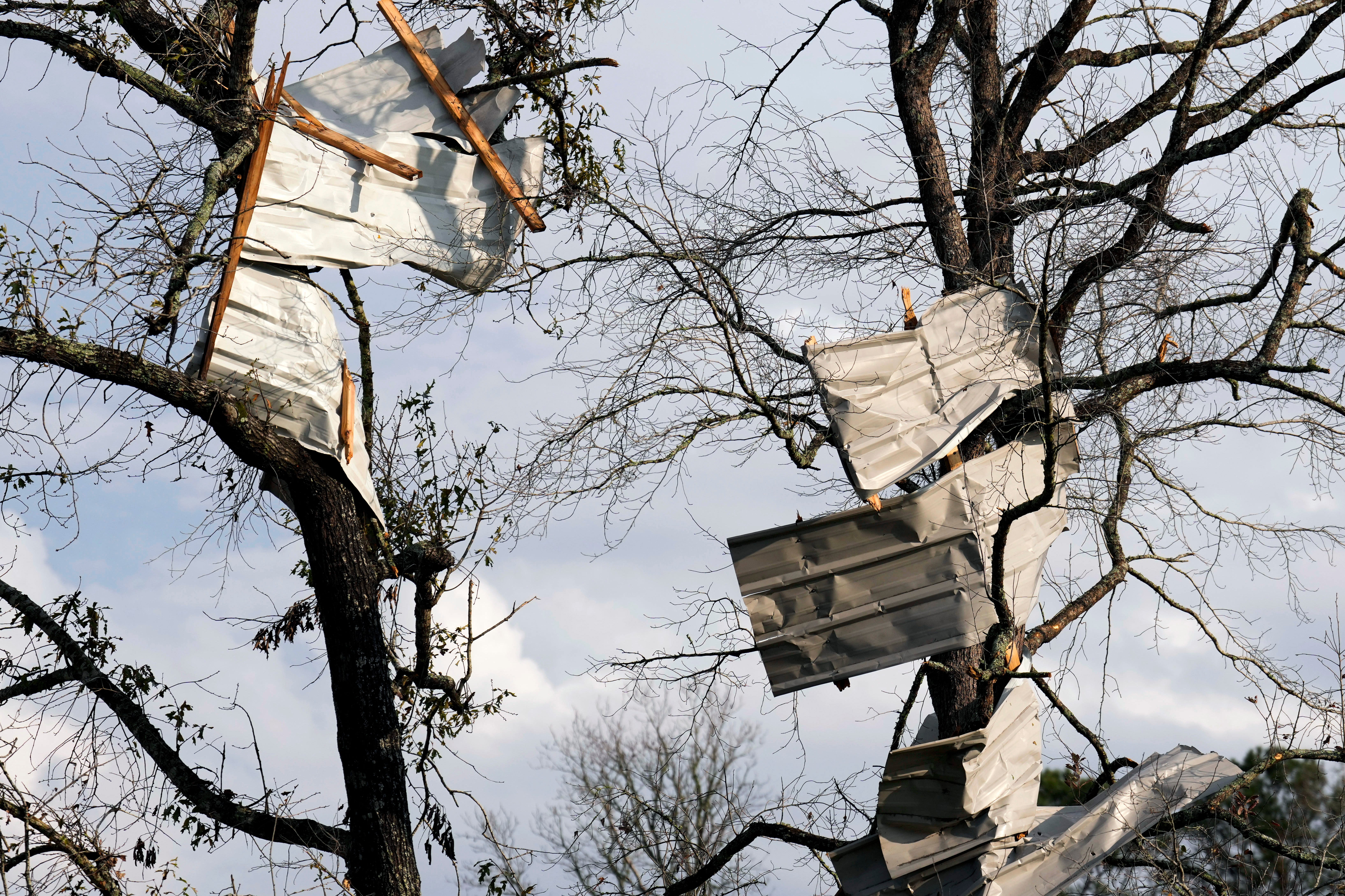 Metal roofing sheets are seen on trees after strong thunderstorms pass through the Greater Houston region.