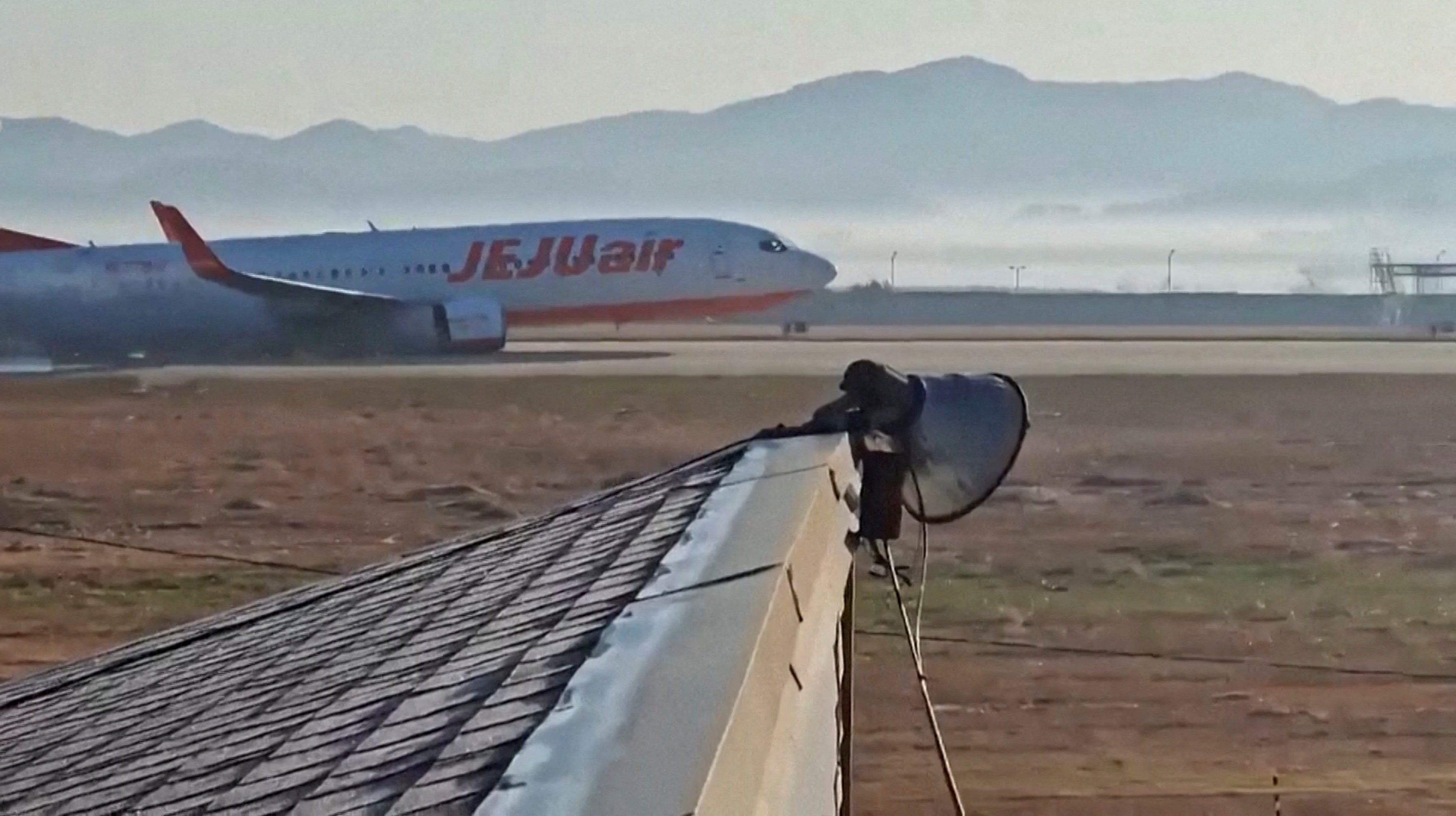 Footage showed the Jeju Air flight coming down on the runway before crashing into a concrete barrier