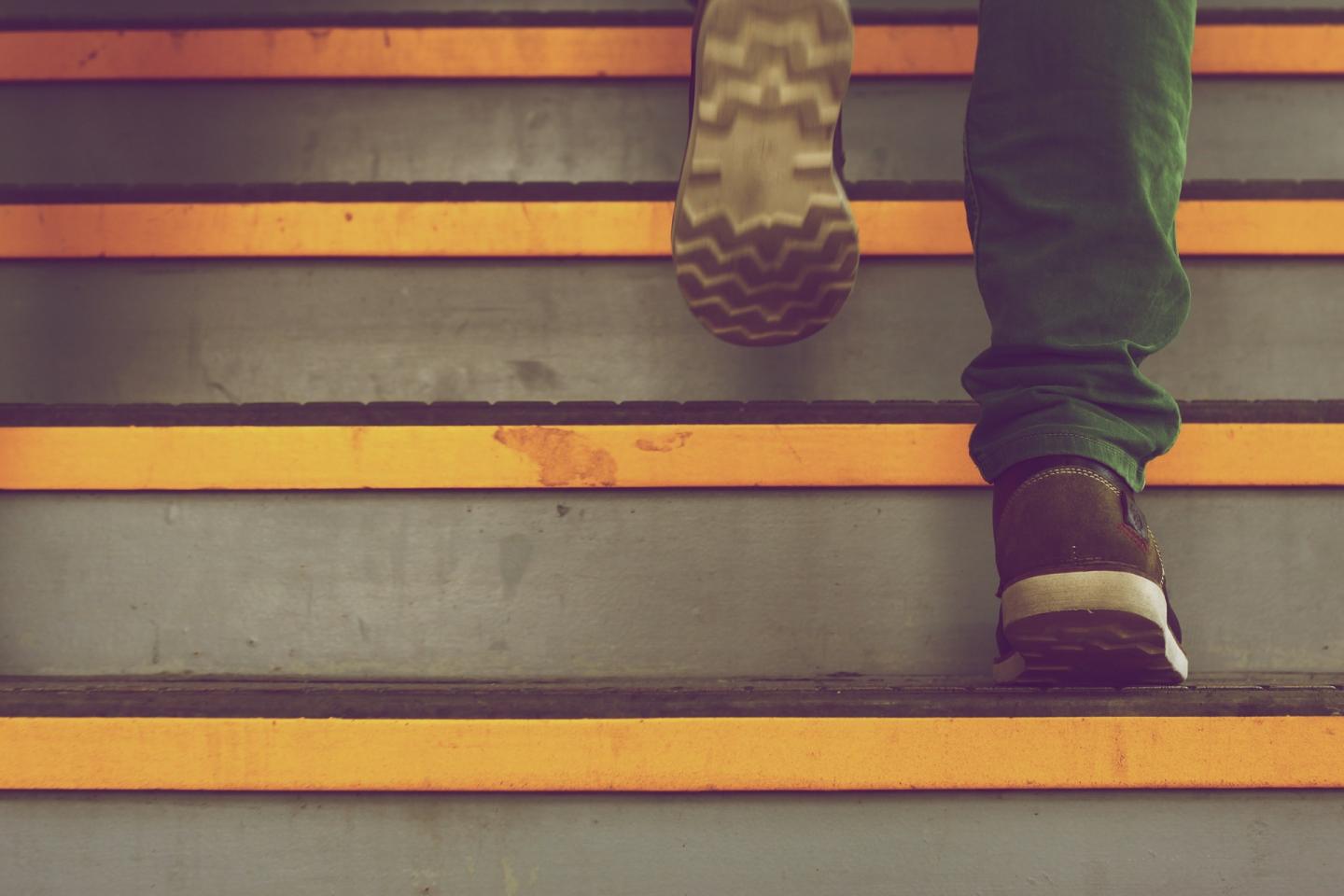 Adult walking up stairs