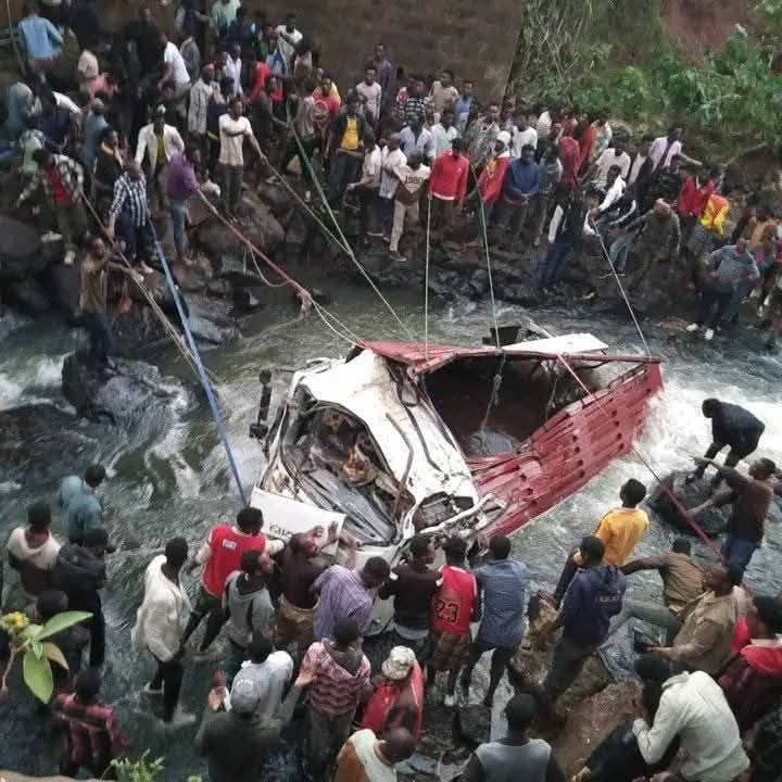 People work to pull out the truck which plunged into a river in Ethiopia