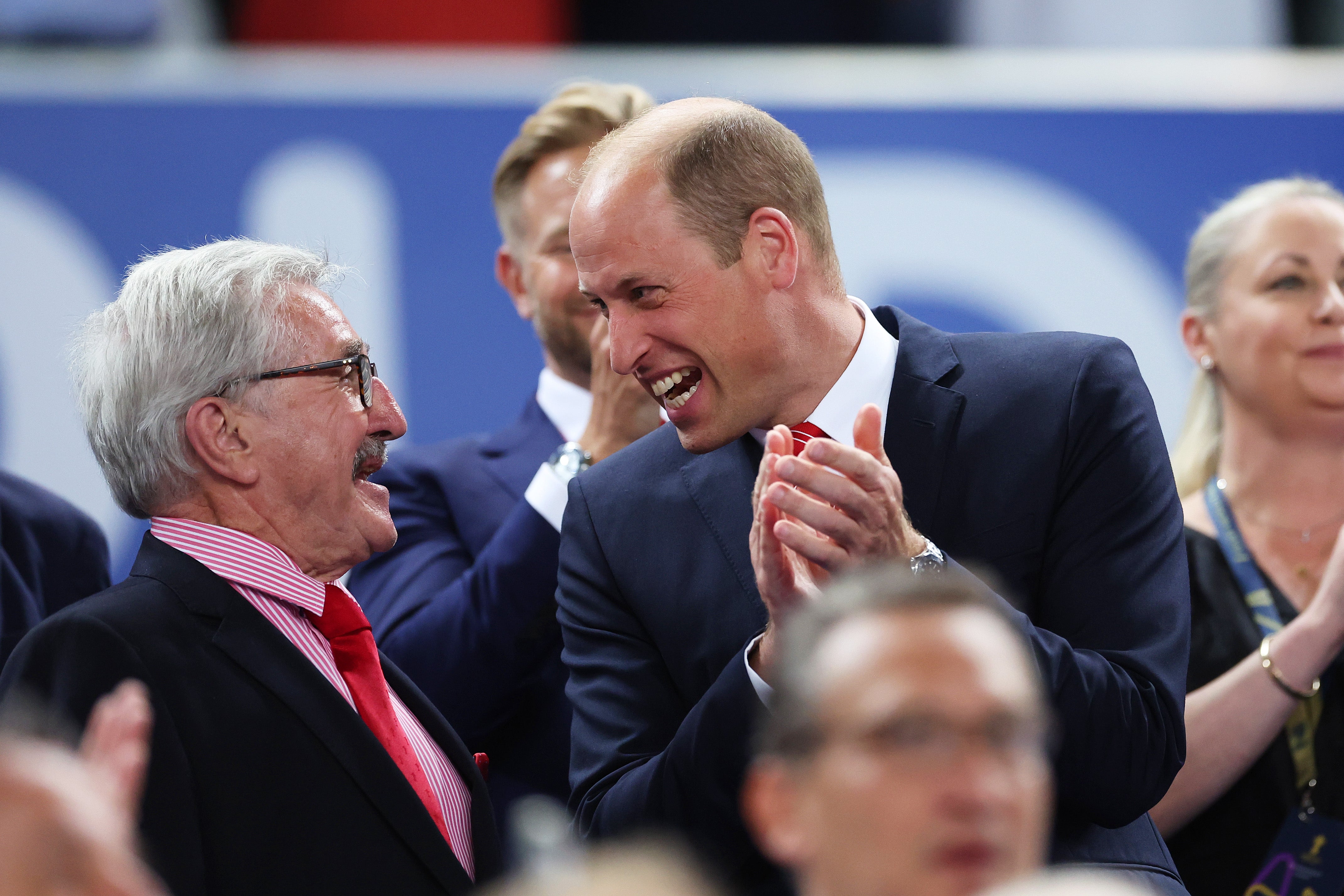 Wales and Lions legend Gerald Davies (seen here with Prince William in 2023) has been knighted