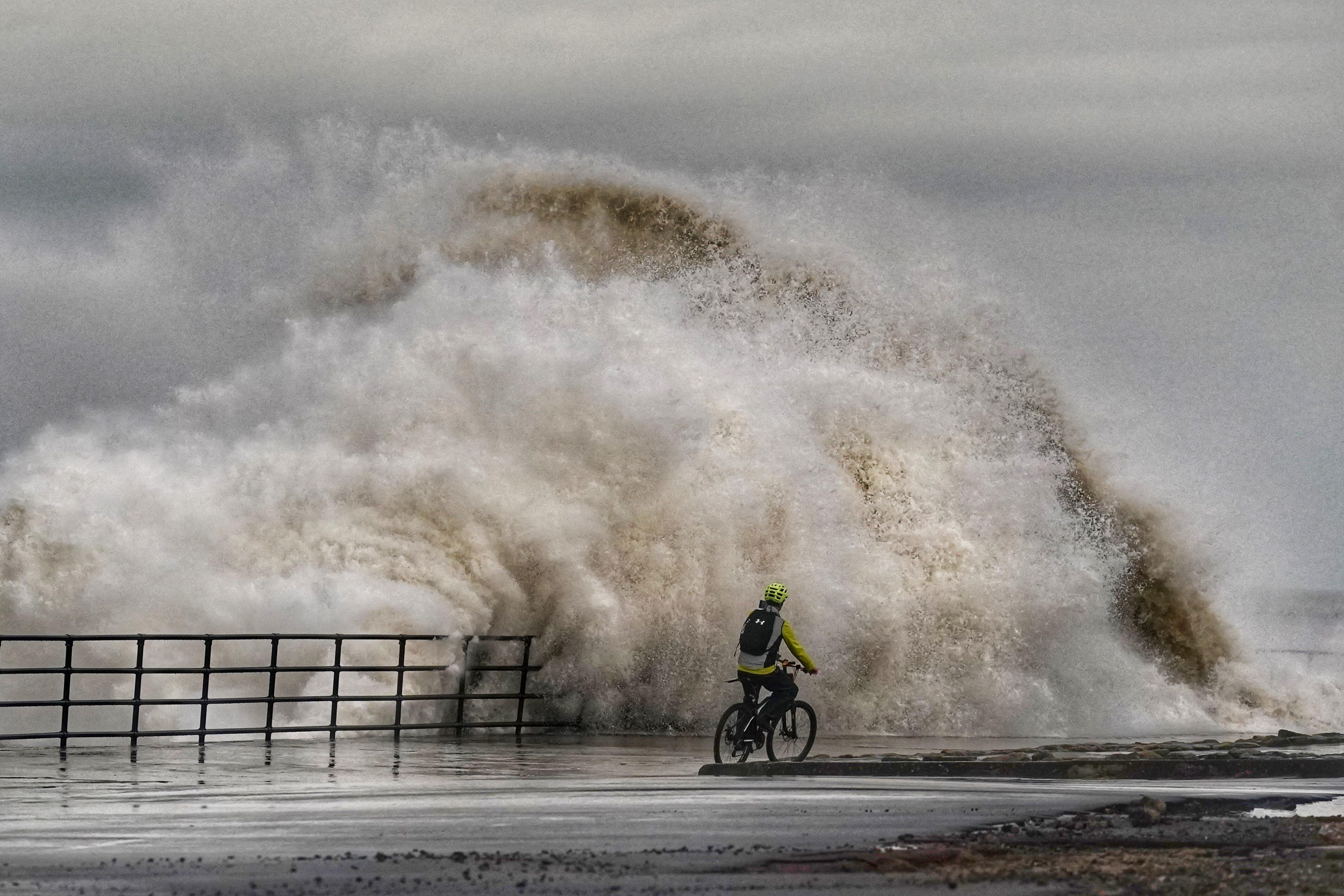 Huge waves crash against the sea wall near Whitley Bay (Owen Humphreys/PA)