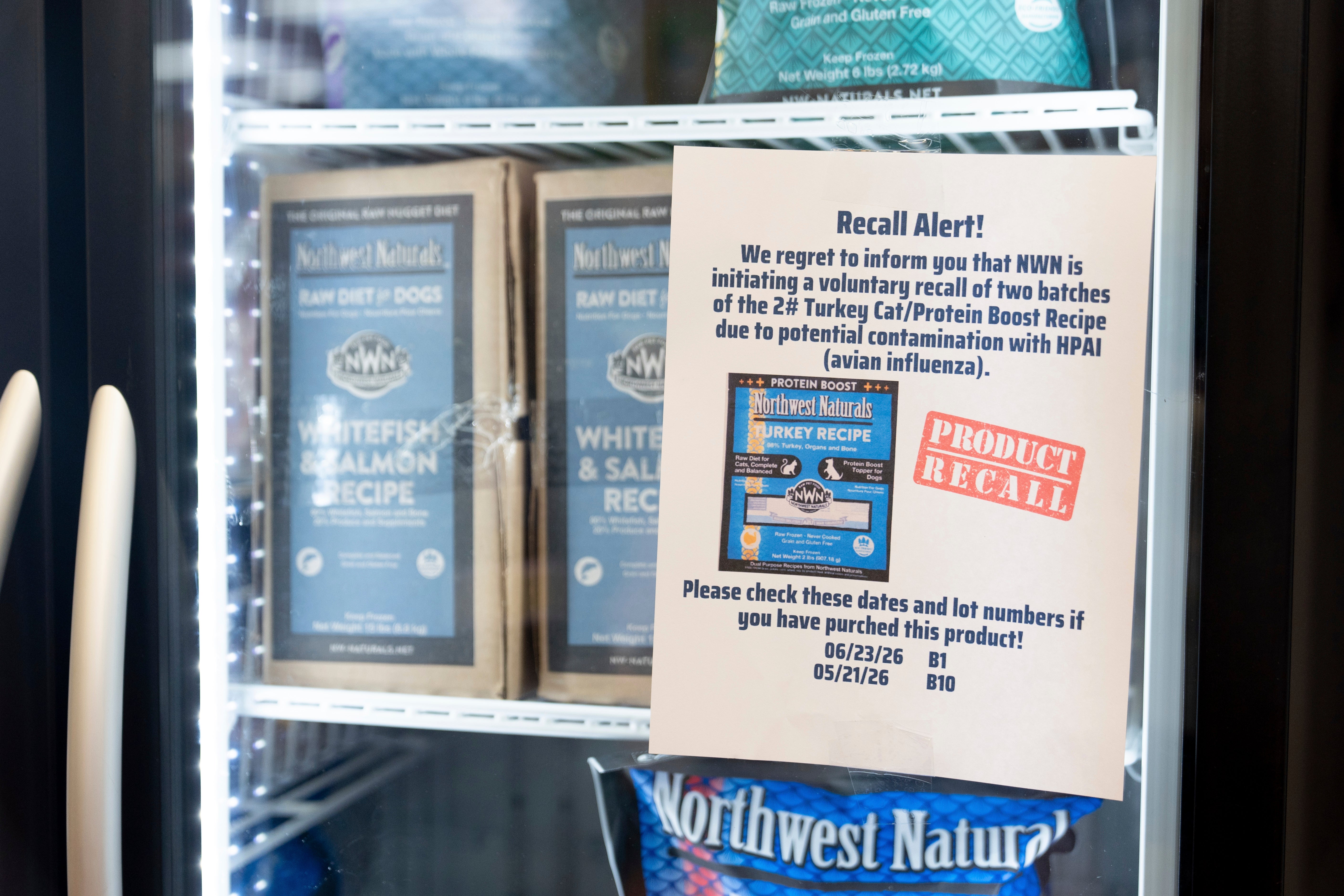 A recall alert is displayed on a refrigerator at a pet store in Tigard, Oregon, last week. A batch of pet food was recalled after it tested positive for the virus