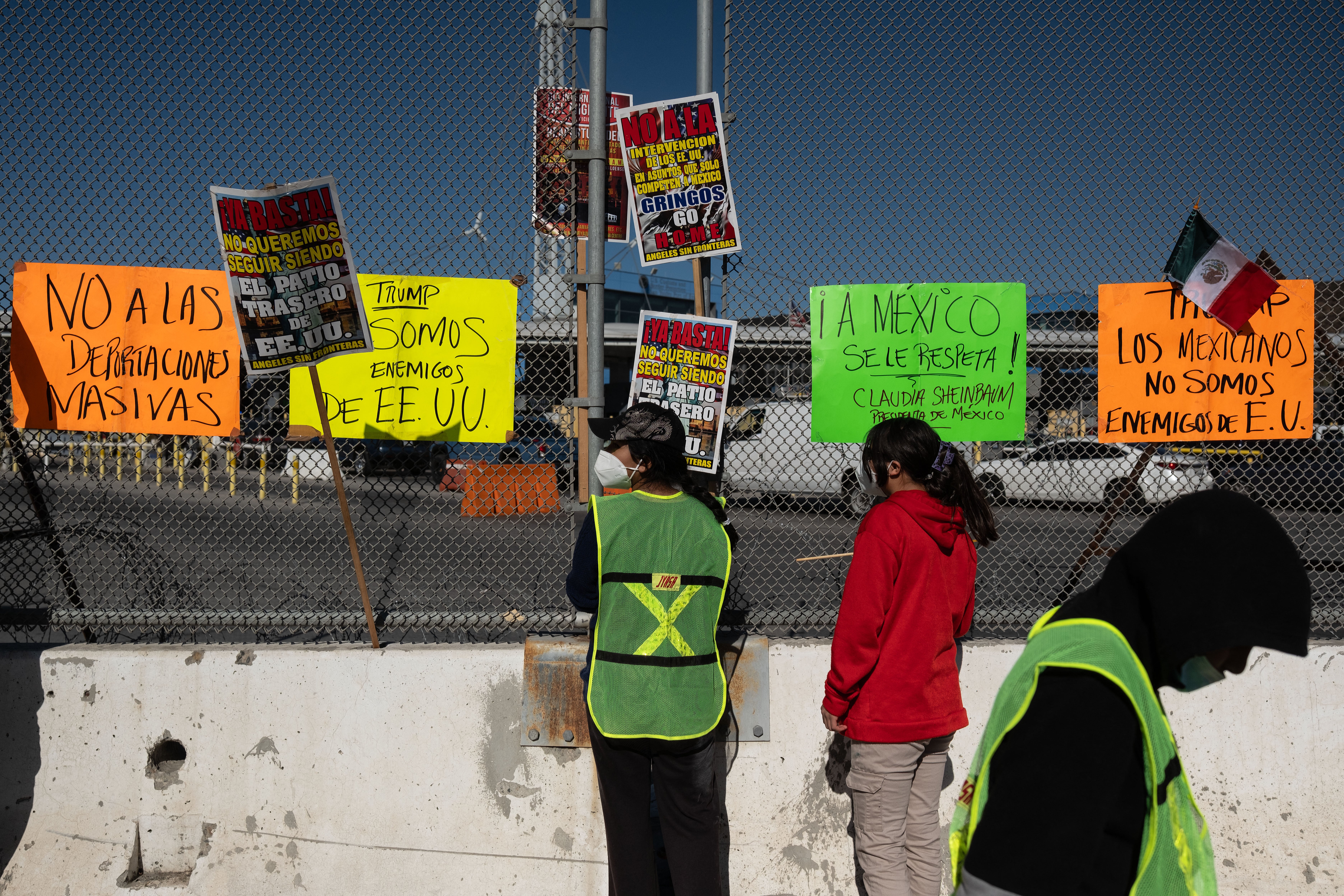 Migrants and advocates demonstrate at the San Ysidro crossing port on the US-Mexico border in Tijuana, Baja California State, Mexico, on December 18, 2024, during International Migrants Day. Trump has suggested that 21 million people be deported from the U.S.