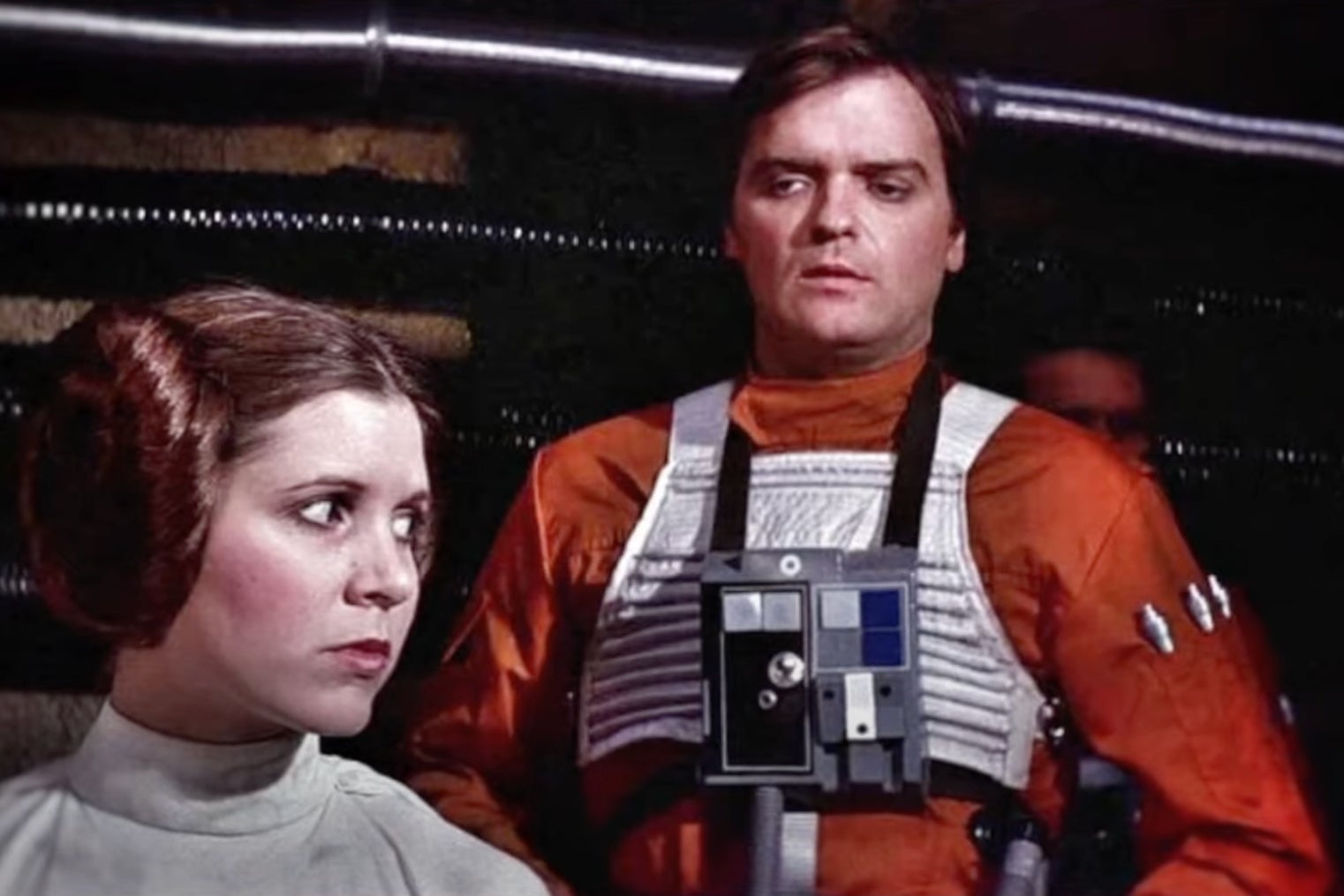 Angus MacInnes as Gold Leader alongside Carrie Fisher in a scene from ‘Star Wars: Episode IV - A New Hope'