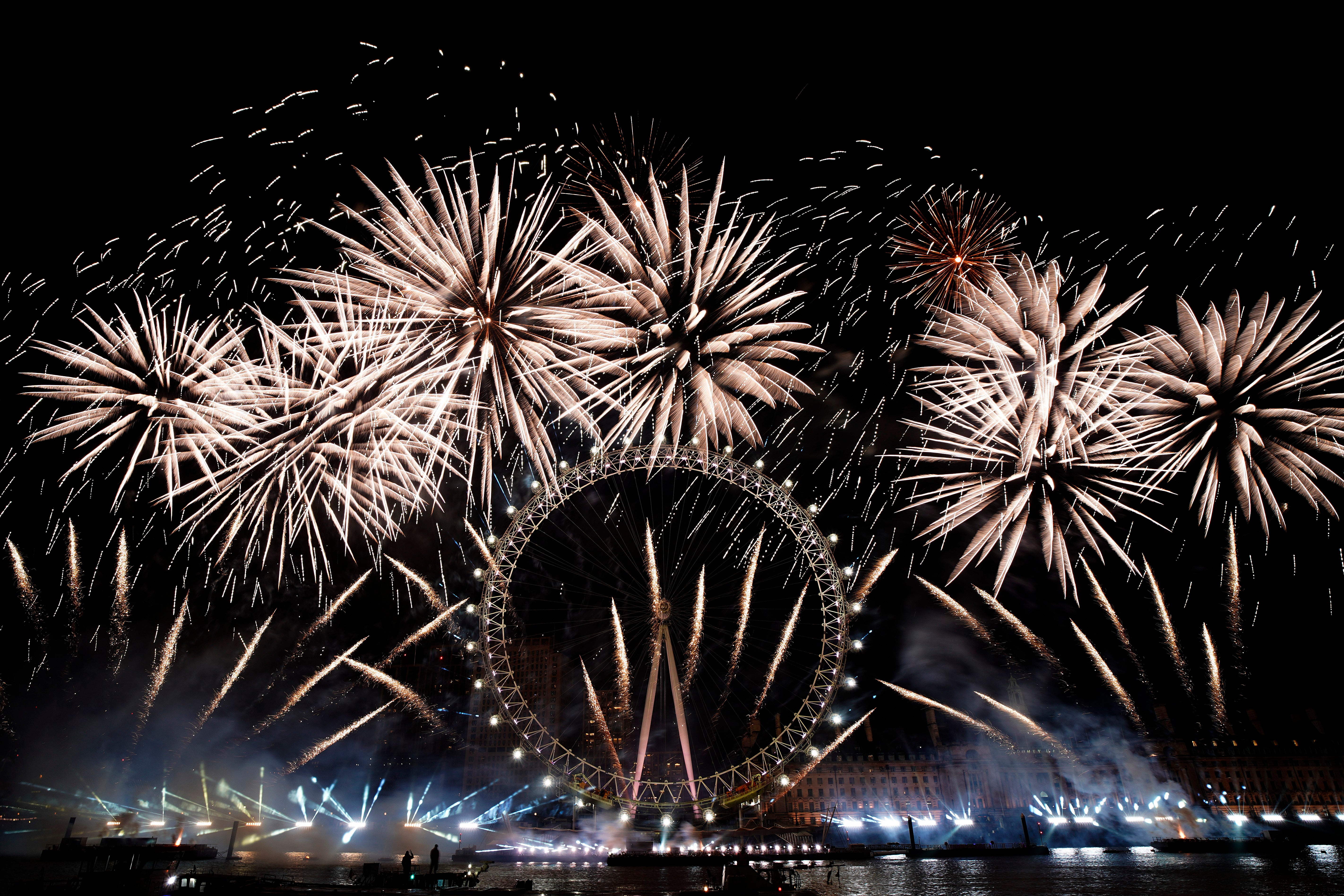 Fireworks light-up the sky over the London Eye in central London to celebrate the New Year on Monday, Jan. 1, 2024