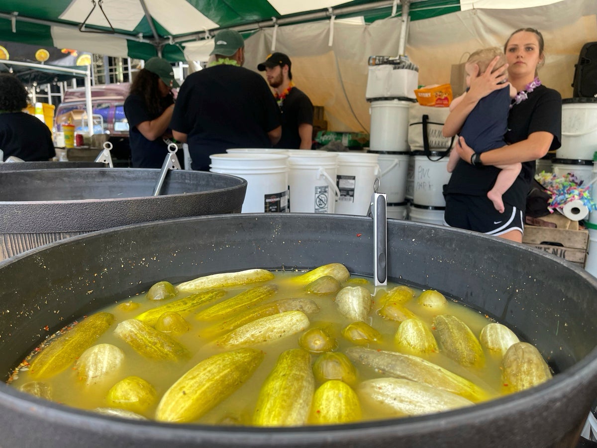 Sour pickles sit in a bucket of brine at a stall at Picklesburgh, Pittsburgh