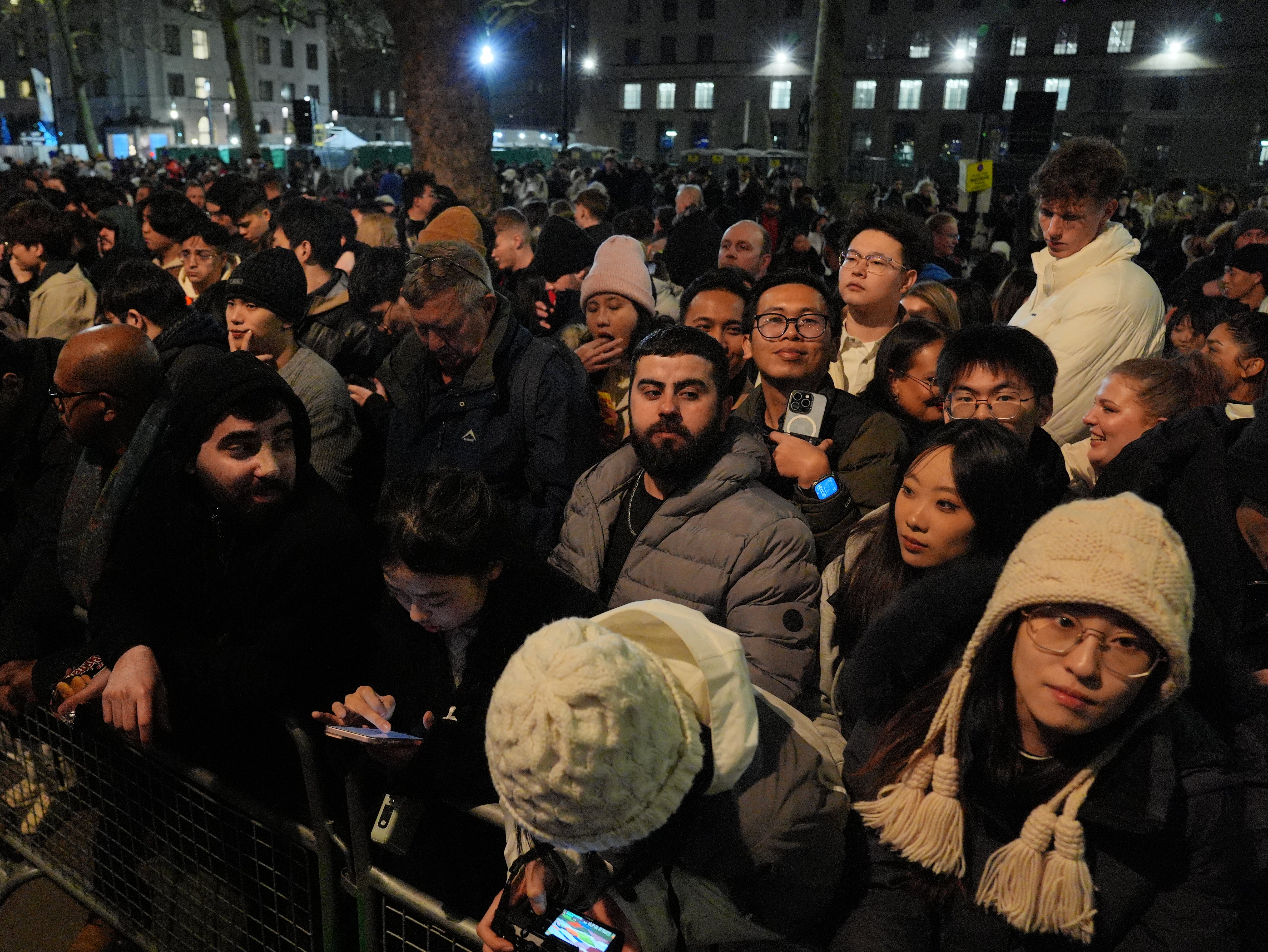 People on London's Embankment waiting for the start of the fireworks display to see in the New Year