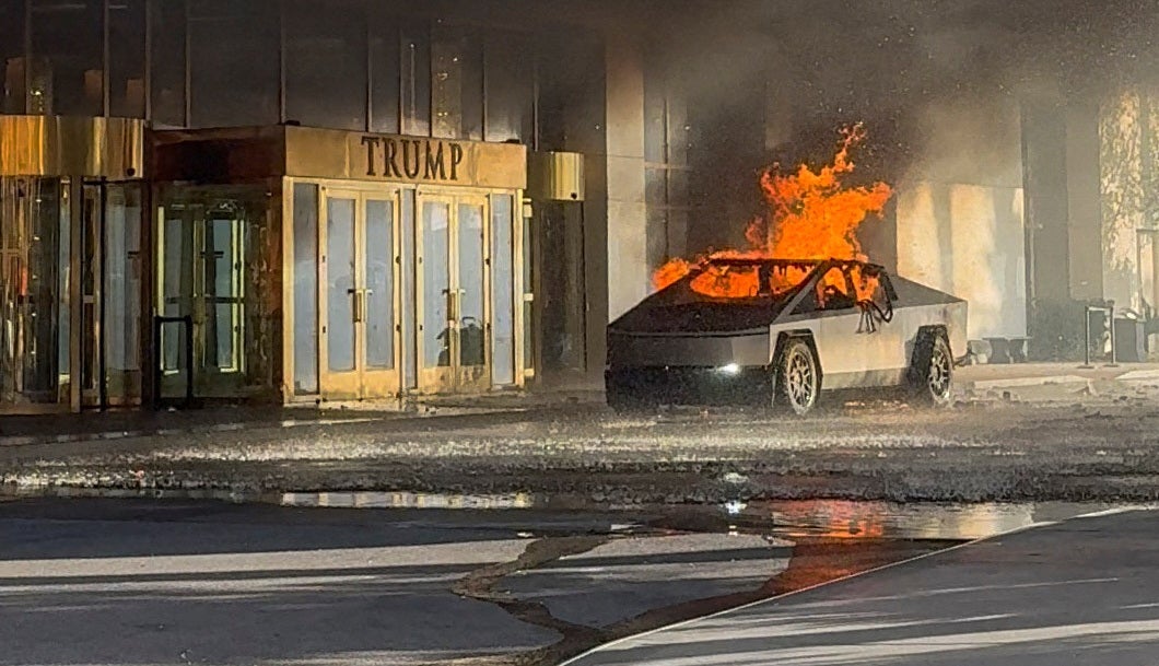 Flames rise from a Tesla Cybertruck after it exploded outside the Trump International Hotel Las Vegas, in Las Vegas, on January 1