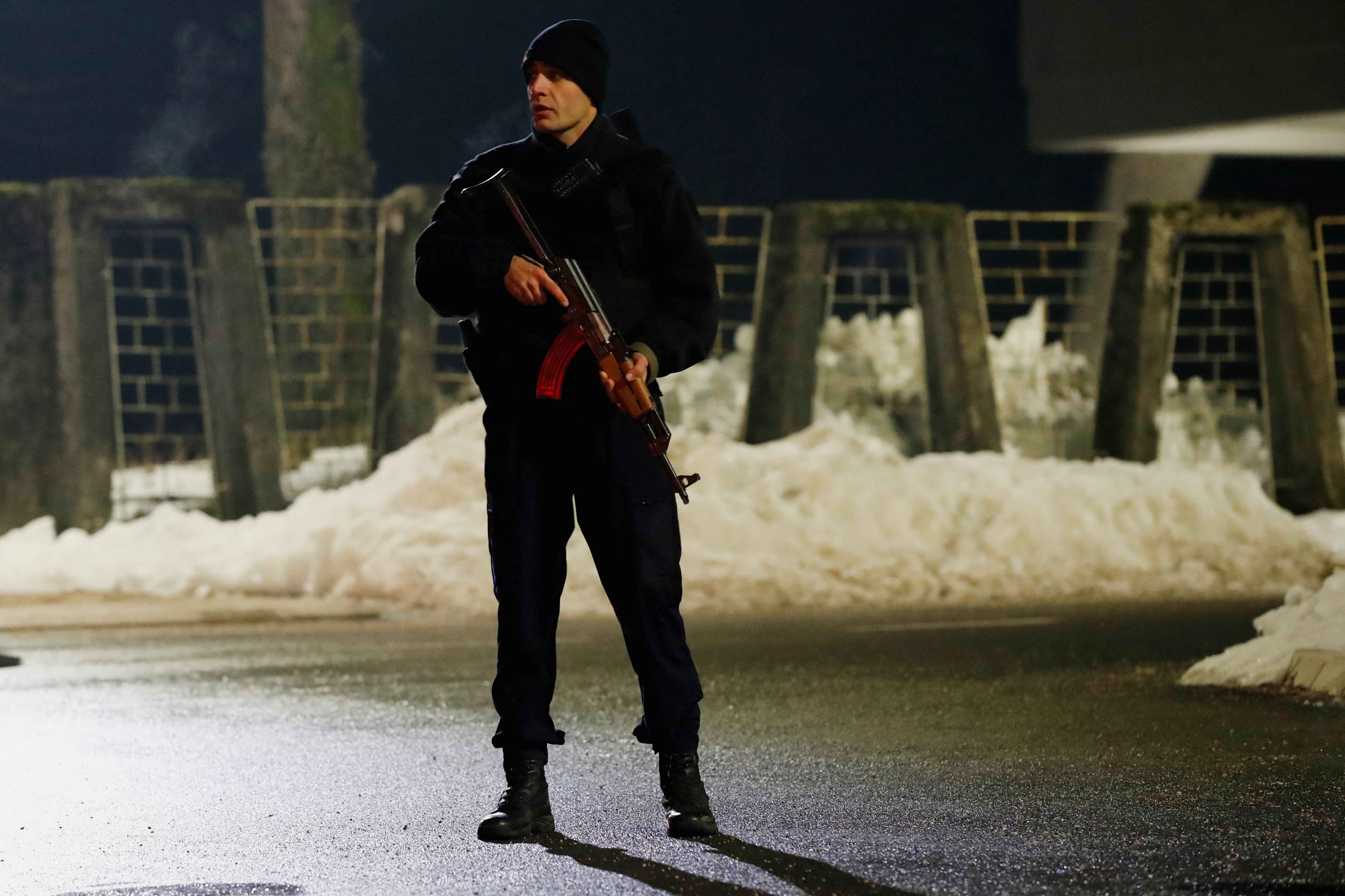 A police officer on a checkpoint near the restaurant