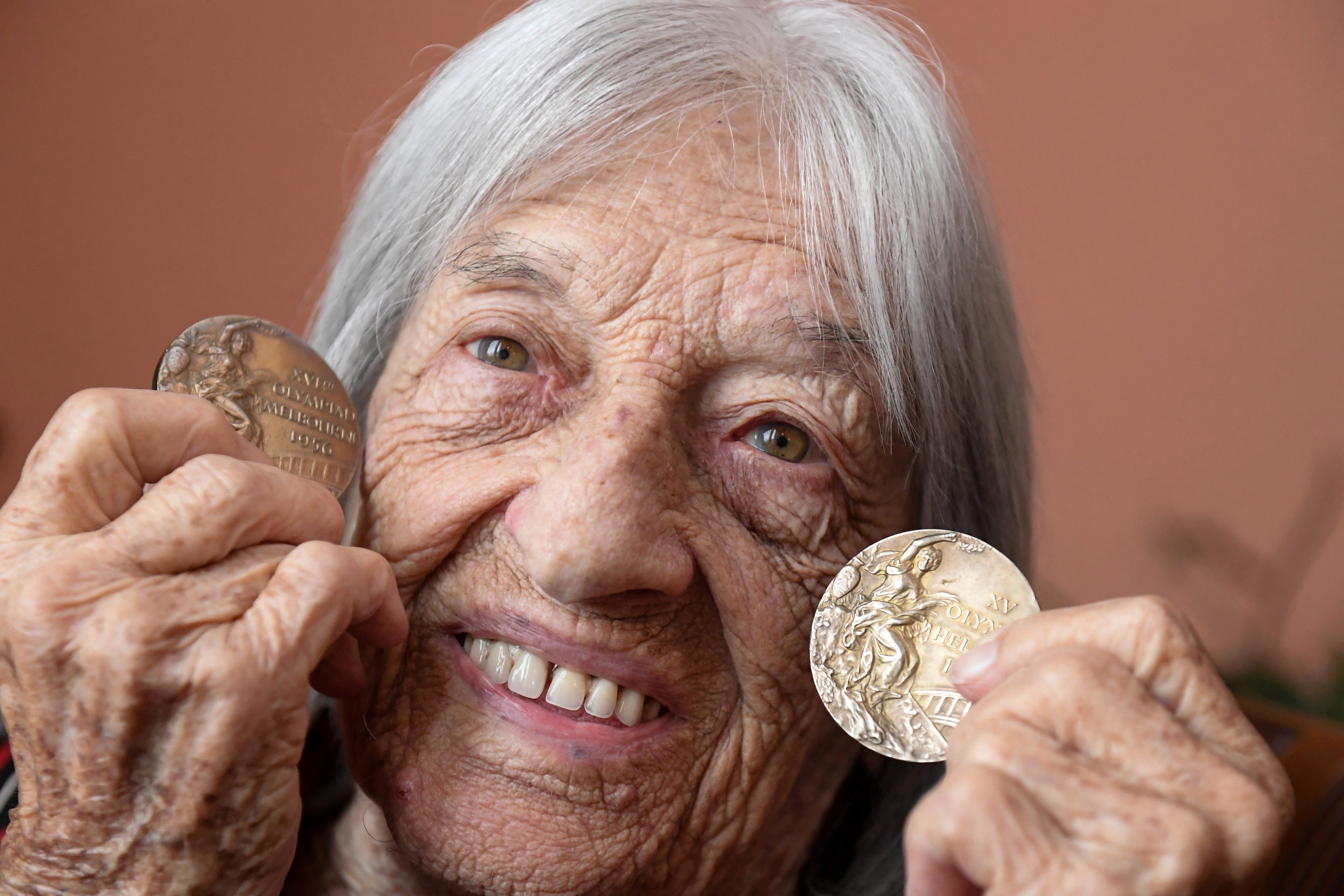 Hungarian-Israeli Olympic and world champion artistic gymnast Agnes Keleti shows gold medals won at Helsinki 1952 and Melbourne 1956