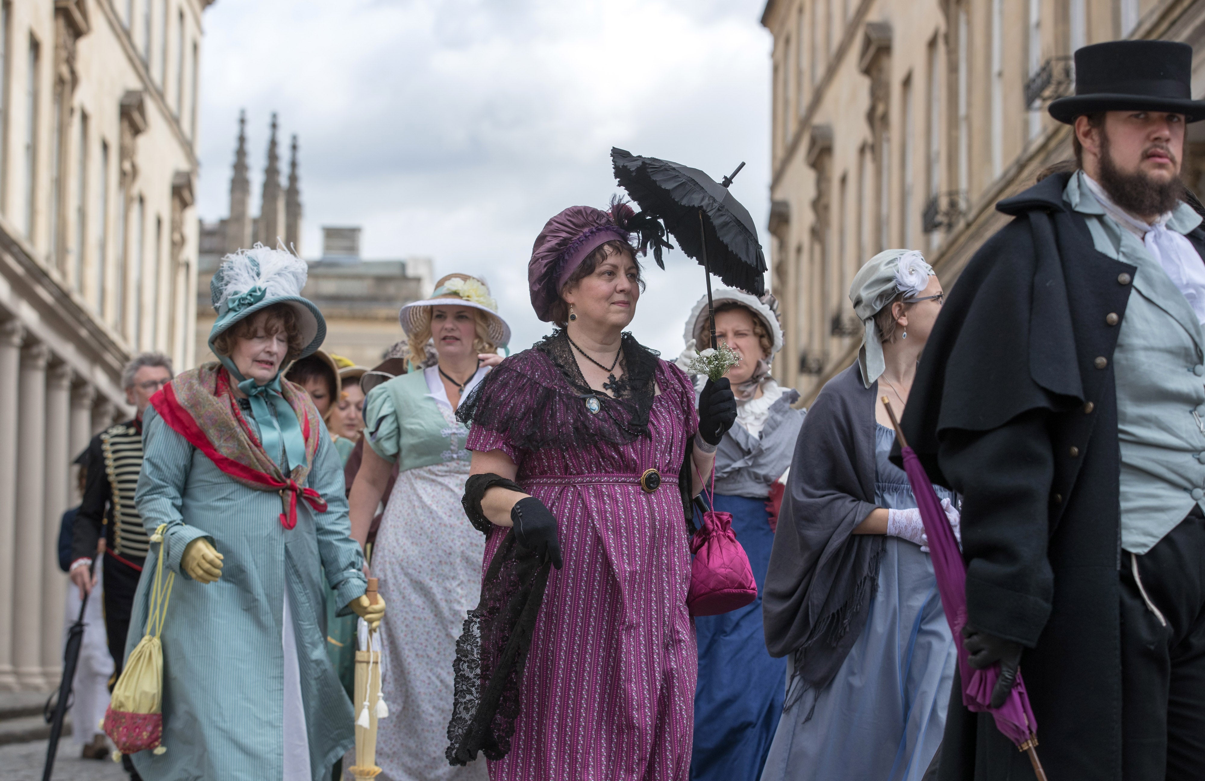 Jane Austen fans take part in a costume parade in Bath, England. Centuries on, the author is bigger than ever