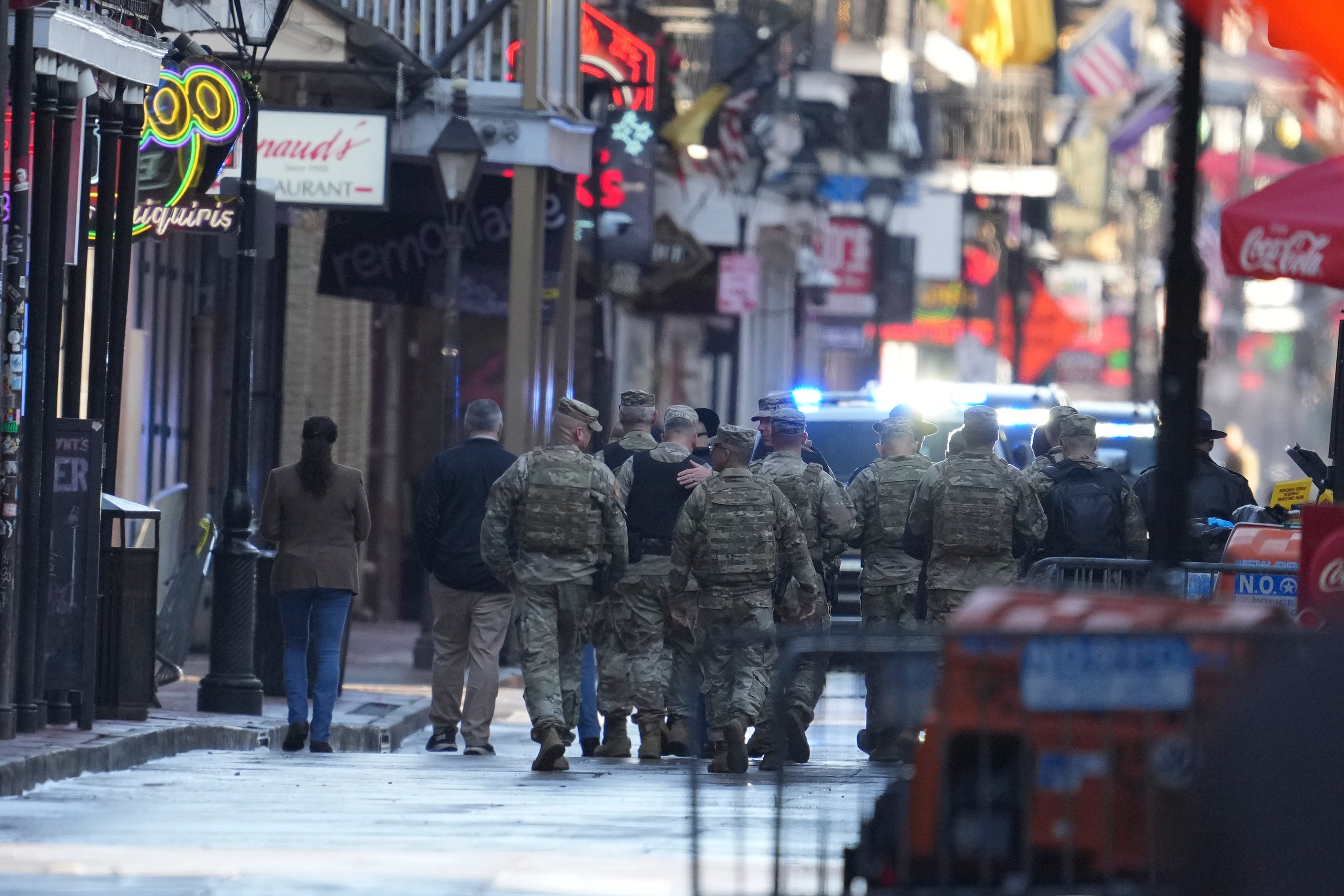 Military personnel walk down Bourbon street, Thursday, Jan. 2, 2025 in New Orleans.