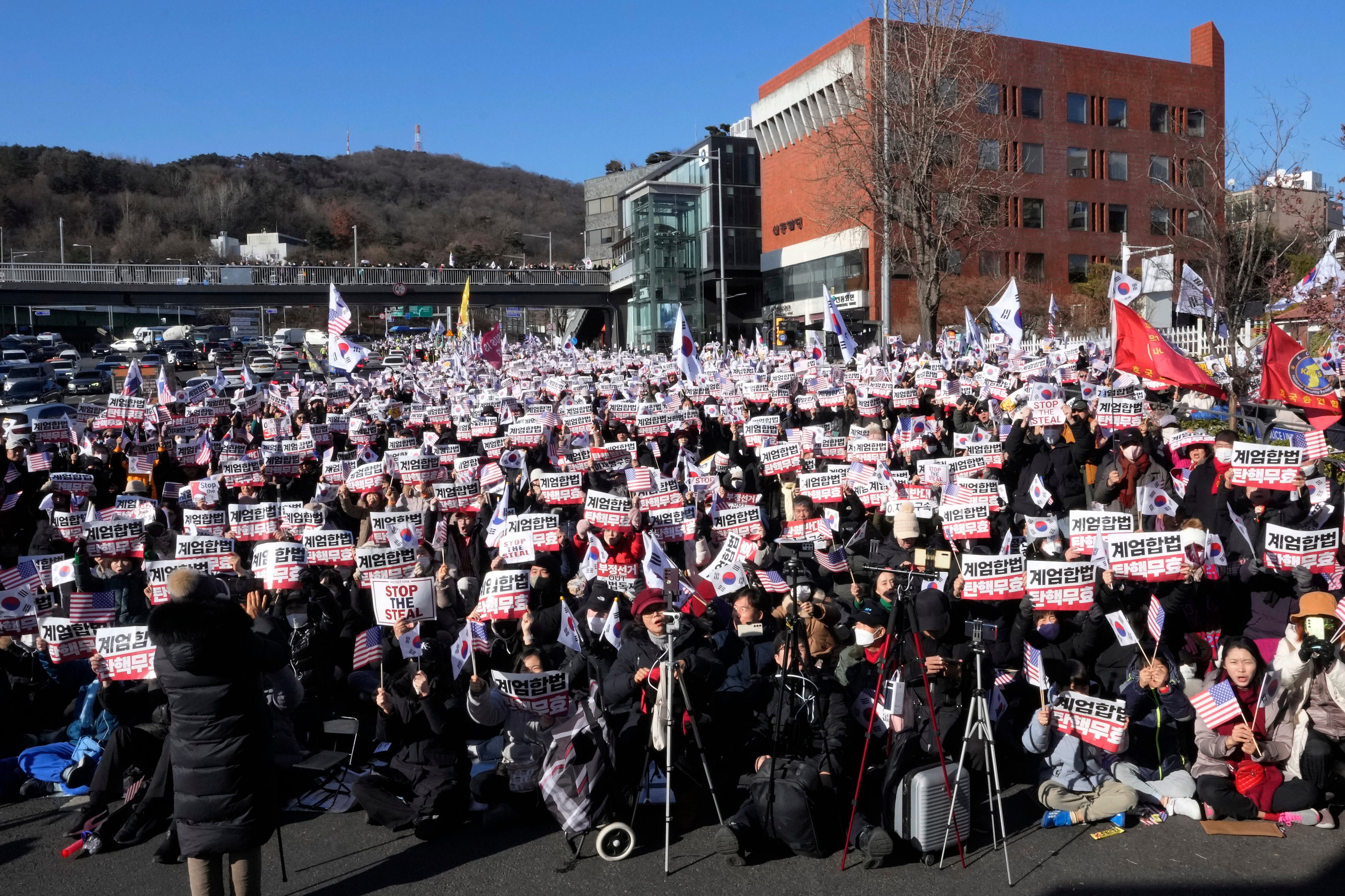 Supporters of impeached South Korean president Yoon Suk Yeol stage a rally