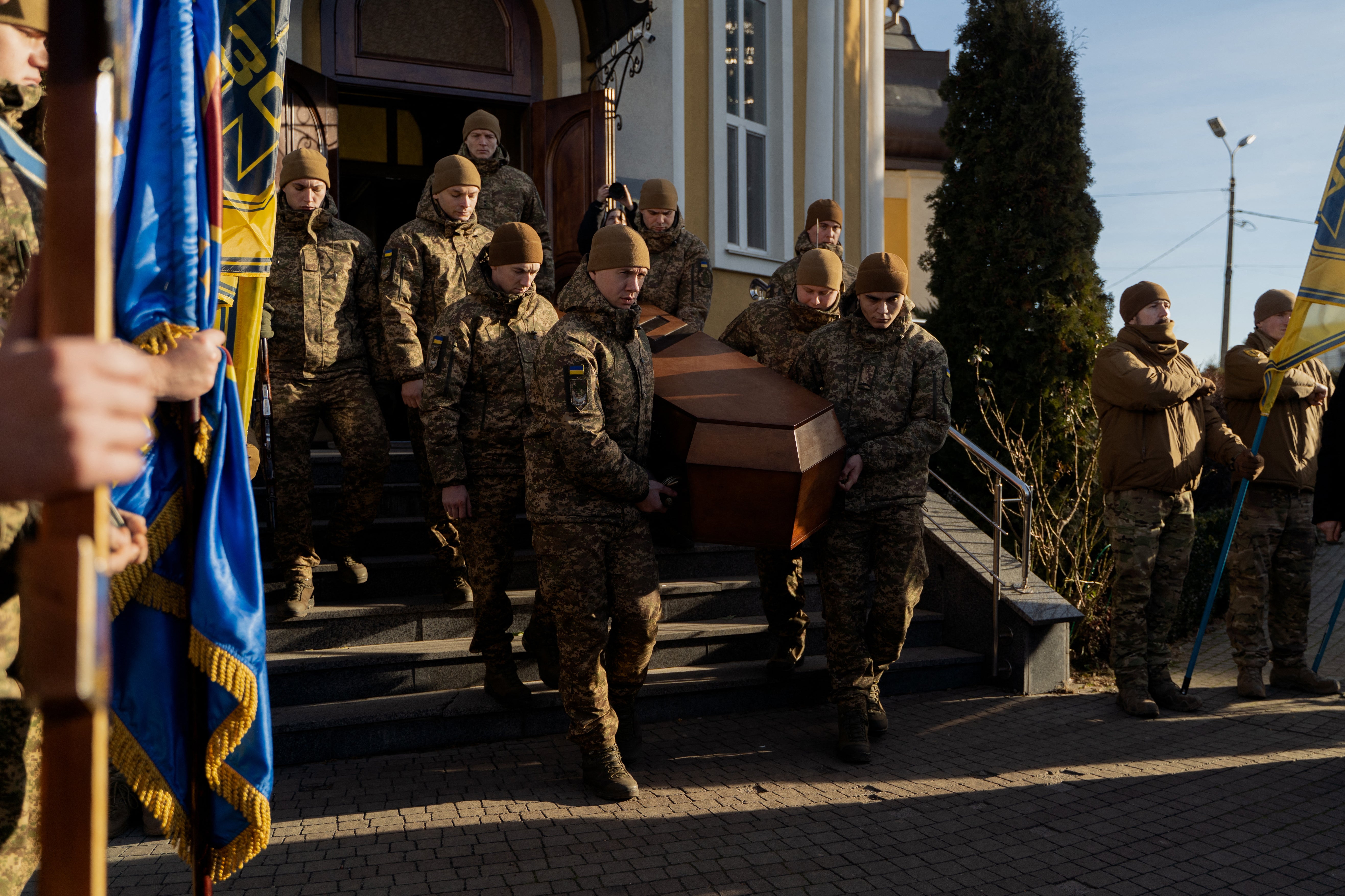 Ukrainian soldiers carry the coffin of late Ukrainian serviceman Danylo Bobrykov, callsign ‘Harvey’’