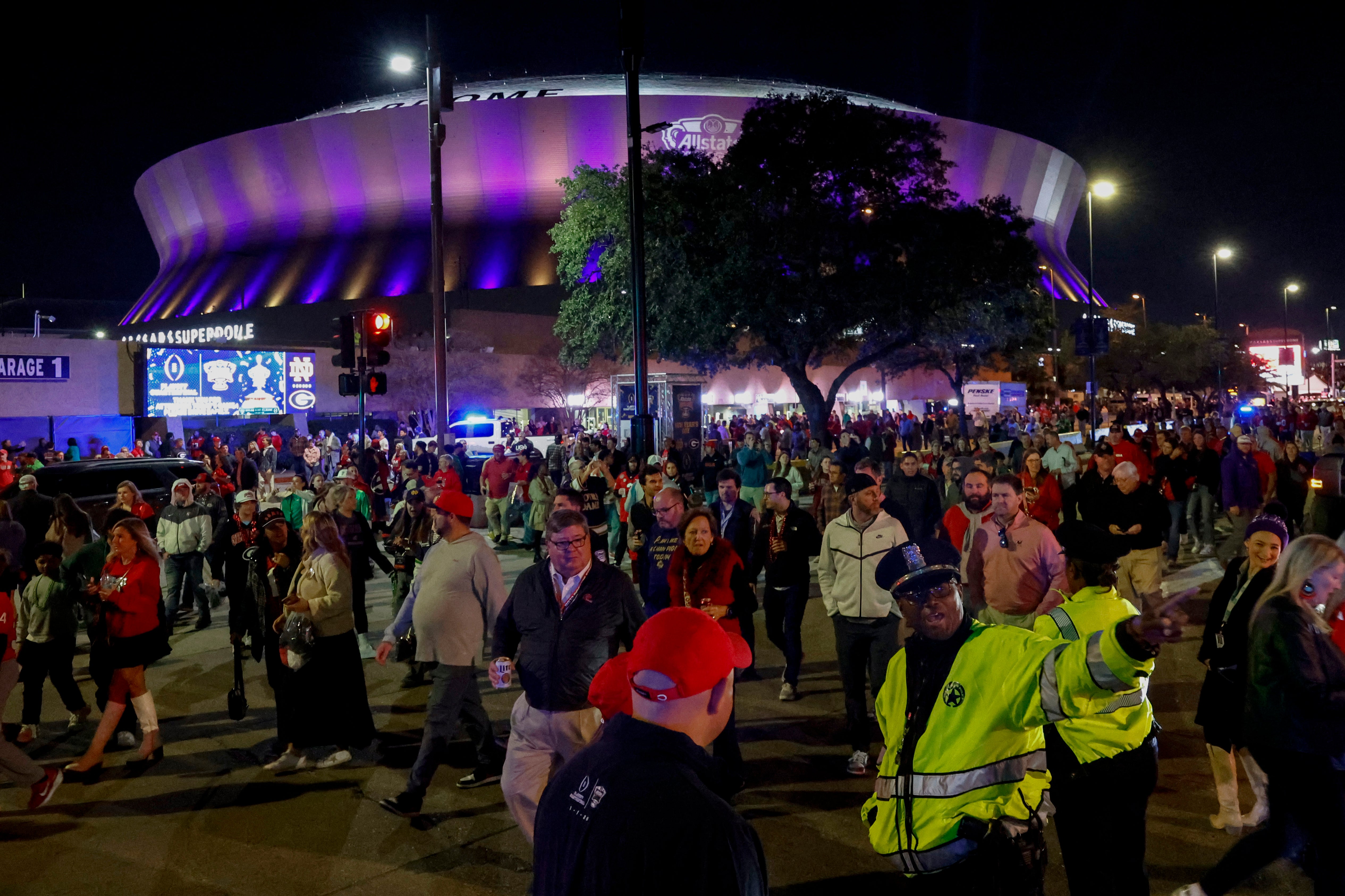 Fans leave the New Orleans Caesars Superdome after the Sugar Bowl NCAA college football playoff game on Thursday