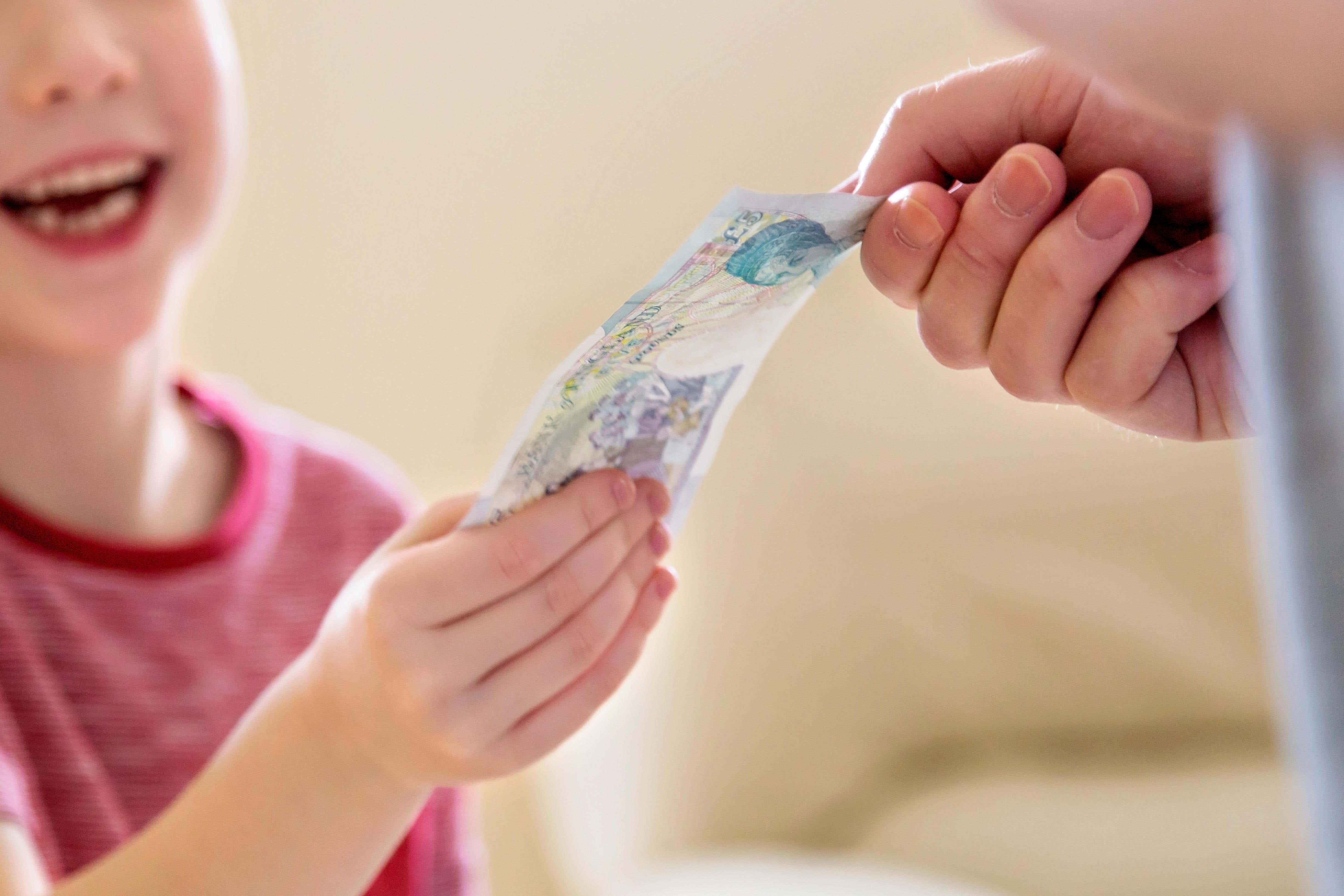 Parents are paying a weekly pocket money average of £9.62 per child, according to data from GoHenry (Alamy/PA)